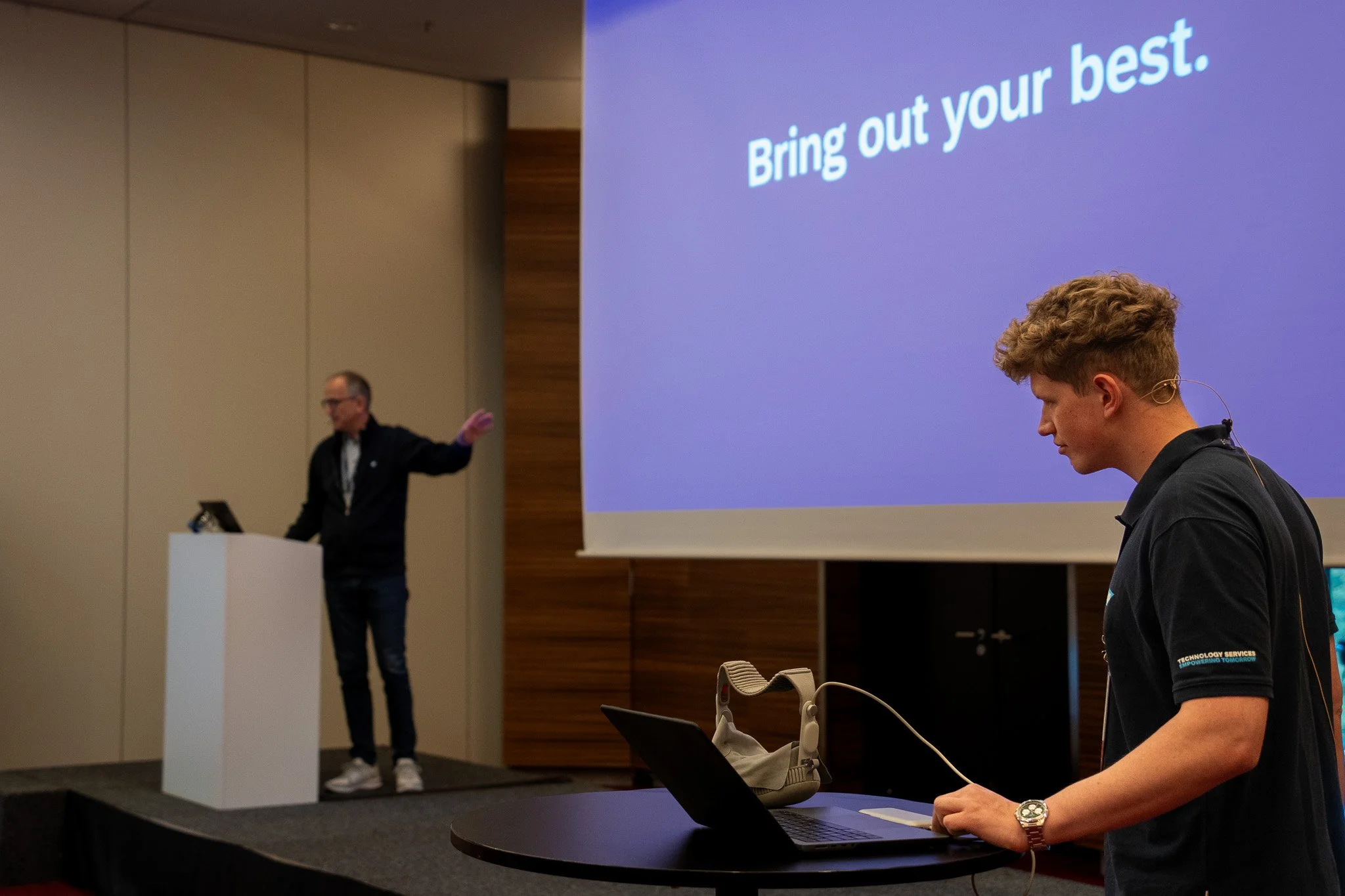 Conference speaker presenting on stage