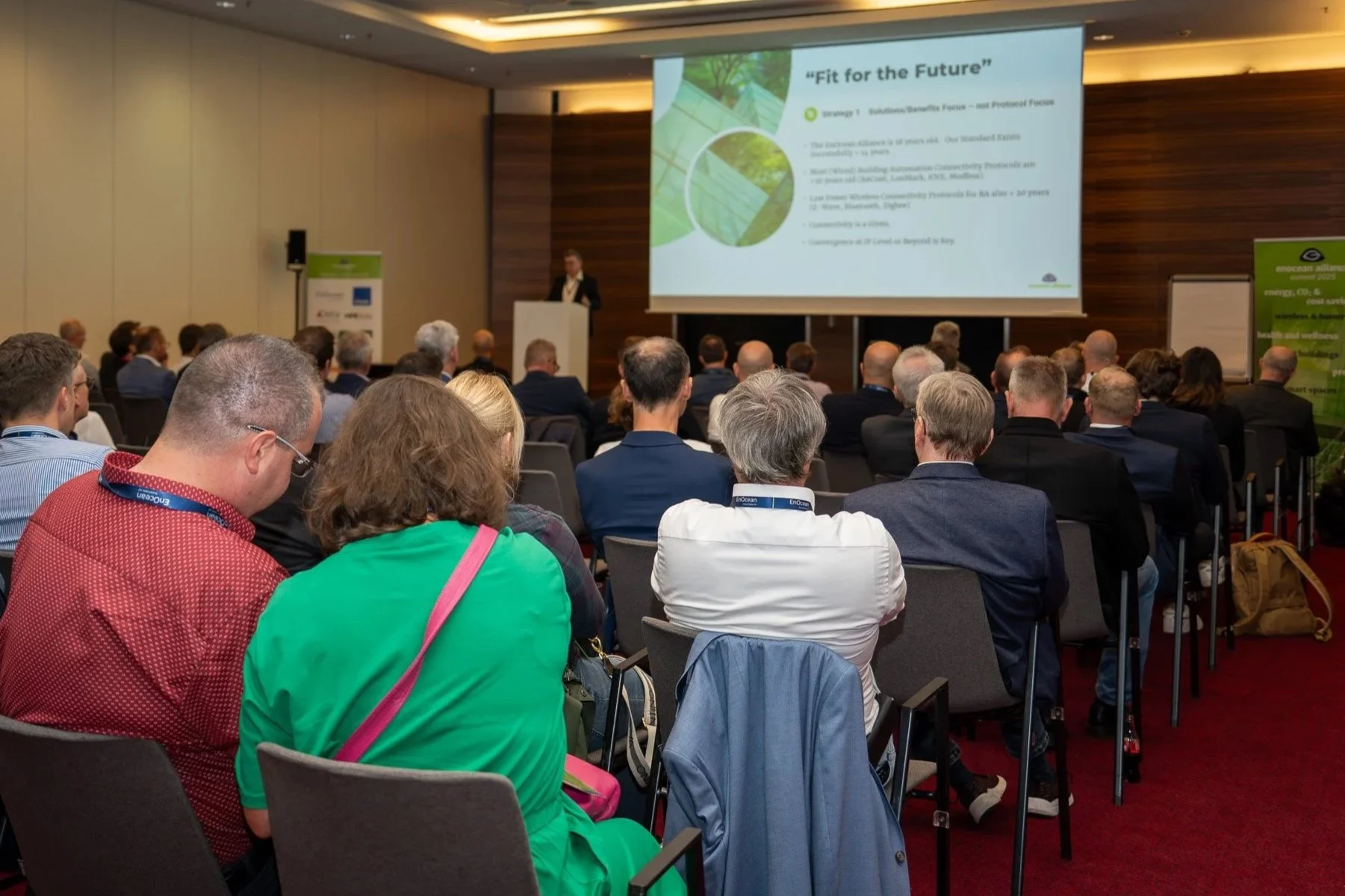 Conference presentation with audience and speaker