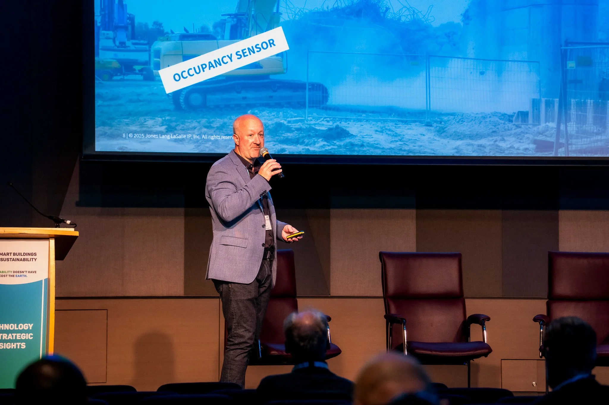 Conference speaker presenting on stage