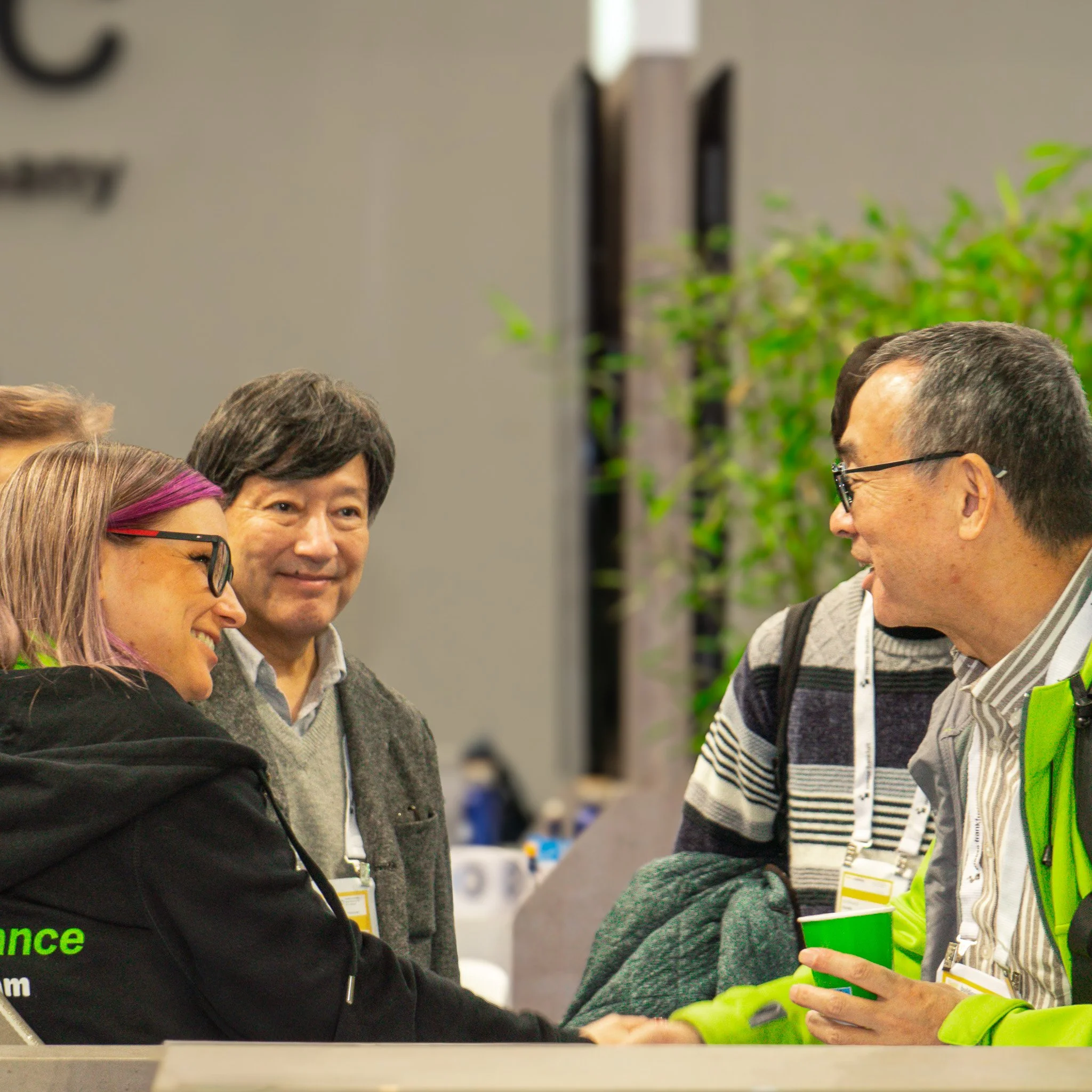Networking at business event with attendees in discussion.