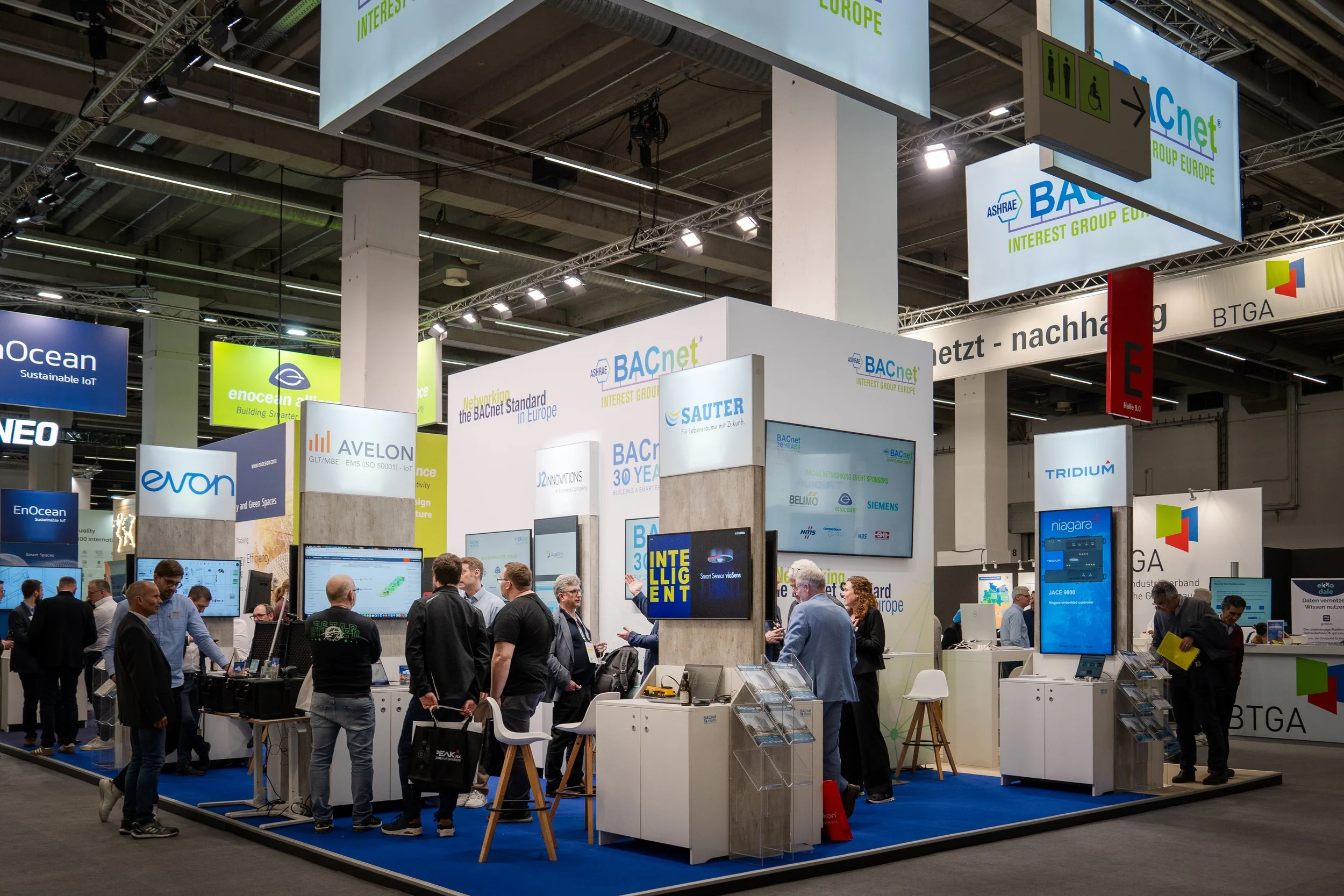Technology trade show booth with attendees