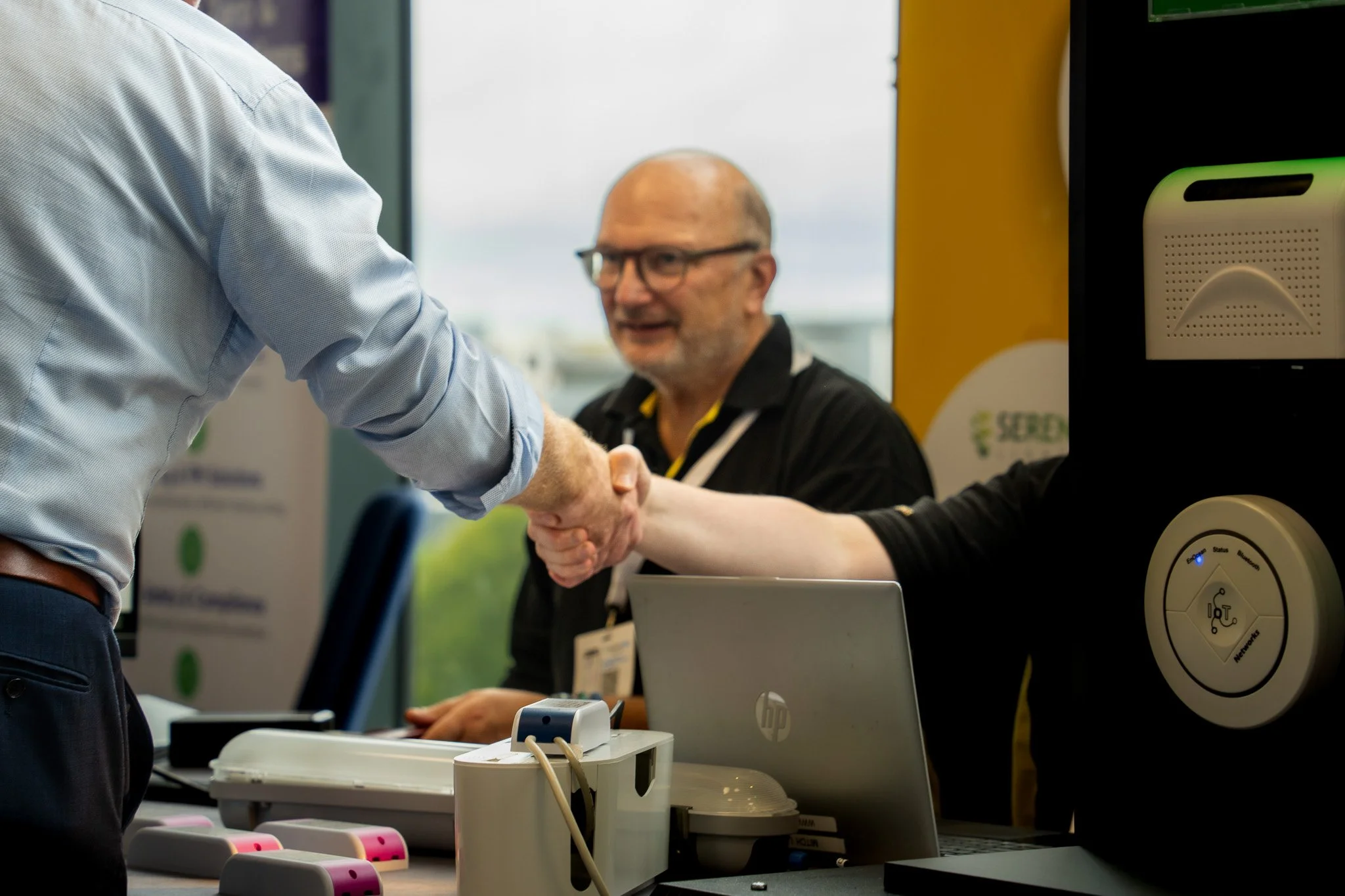 Business professionals shaking hands at meeting