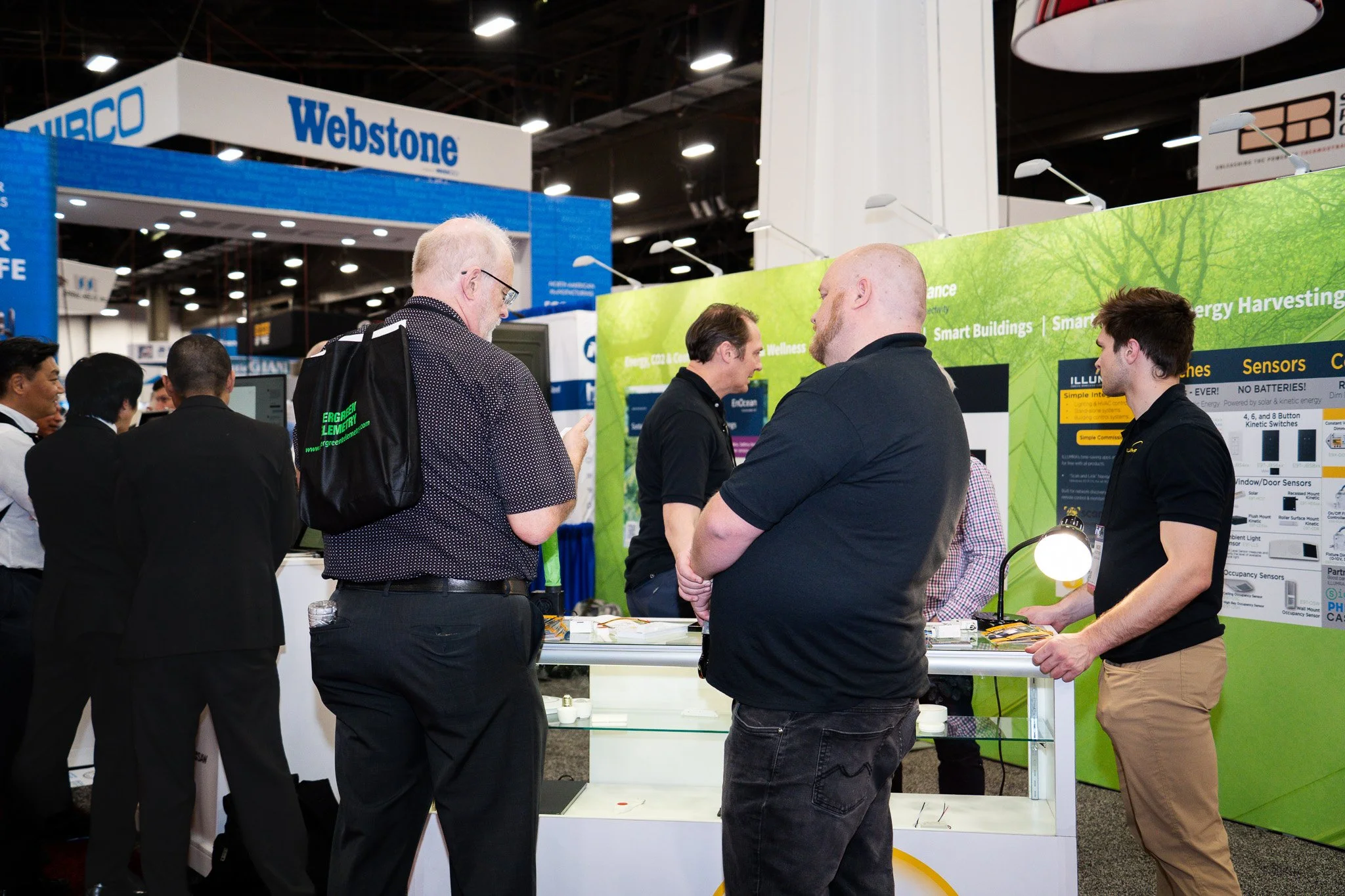 Technology exhibition booth with attendees