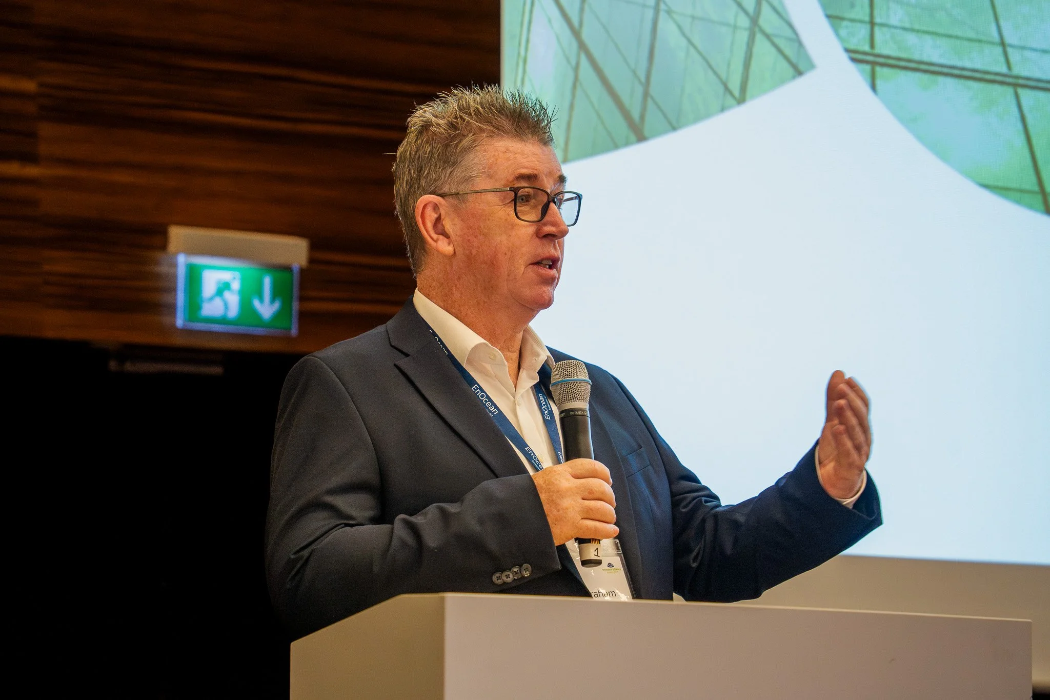 Conference speaker presenting on stage