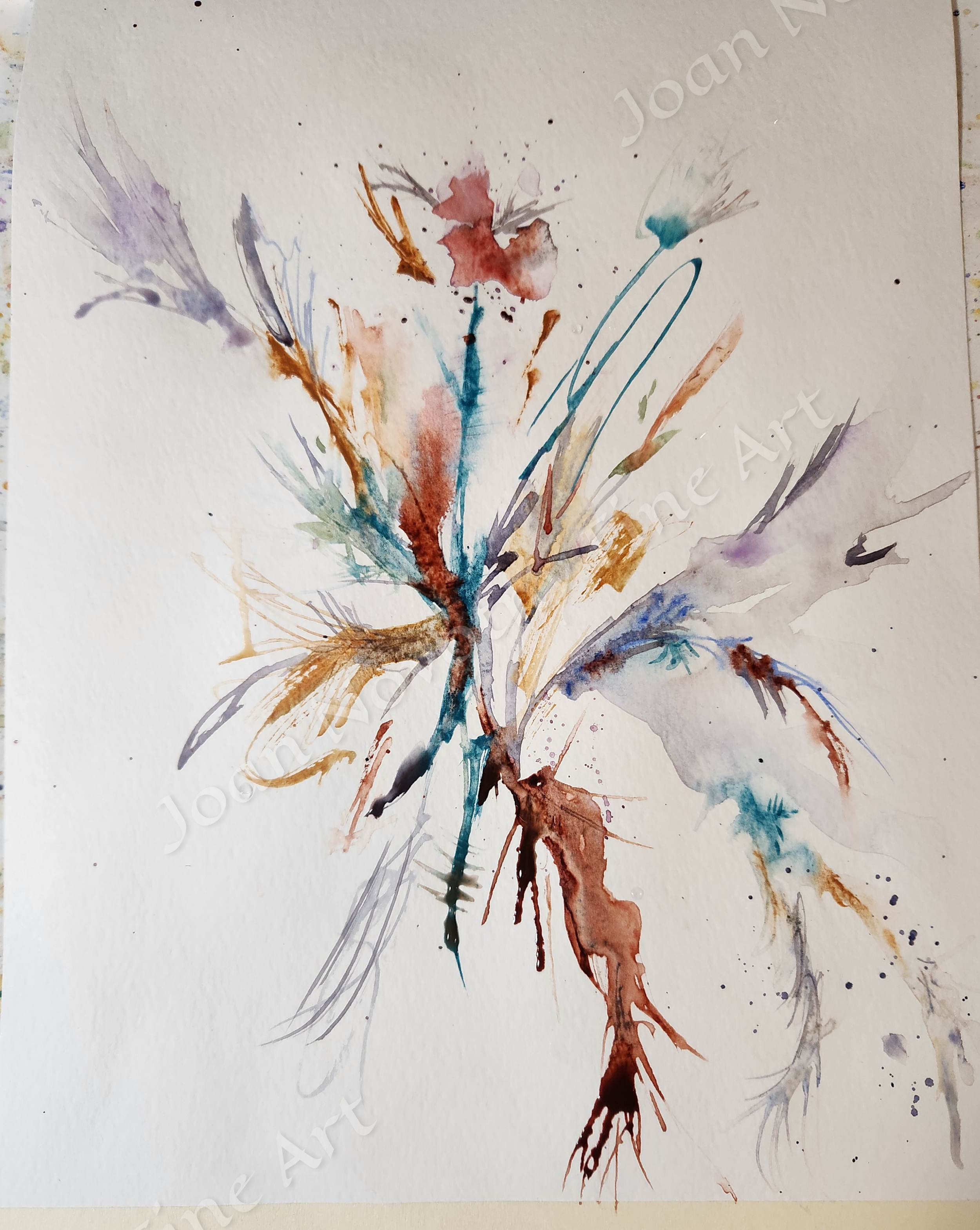 Abstract watercolor painting with splashes and strokes of various colors including purple, blue, brown, and red on white textured paper.