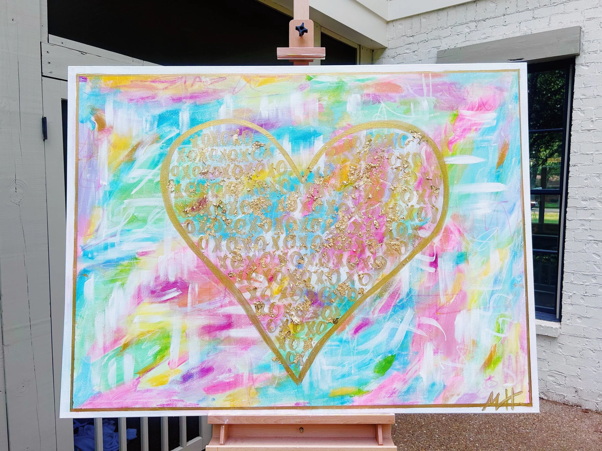 Colorful abstract painting with a gold-outlined heart filled with repeated gold XO patterns on a pastel background.