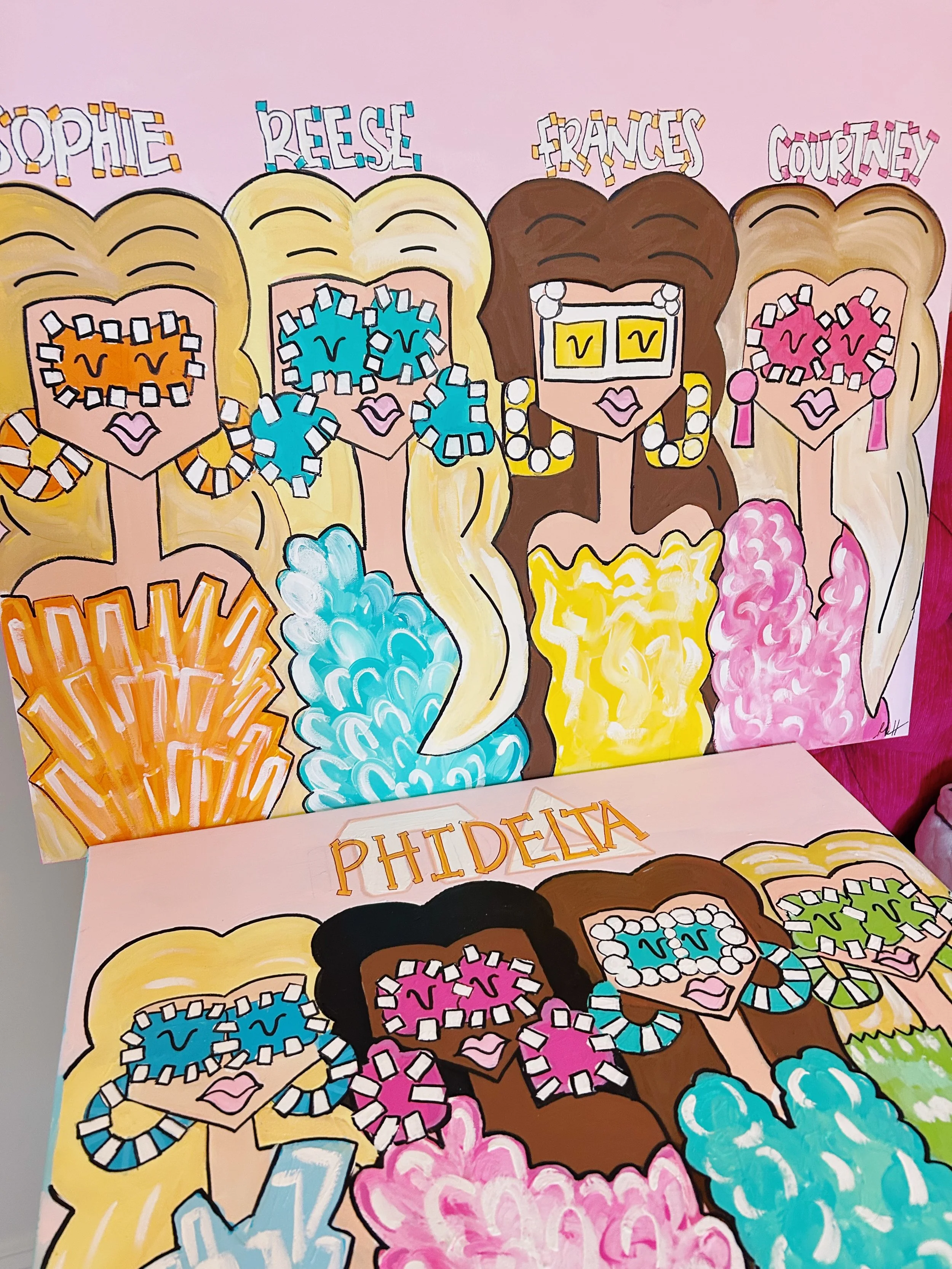 Colorful illustrated artwork of diverse women with detailed hairstyles and accessories, holding up signs with the names SOPHIE, REESE, FRANCES, COURTNEY, and PHIDELIA.