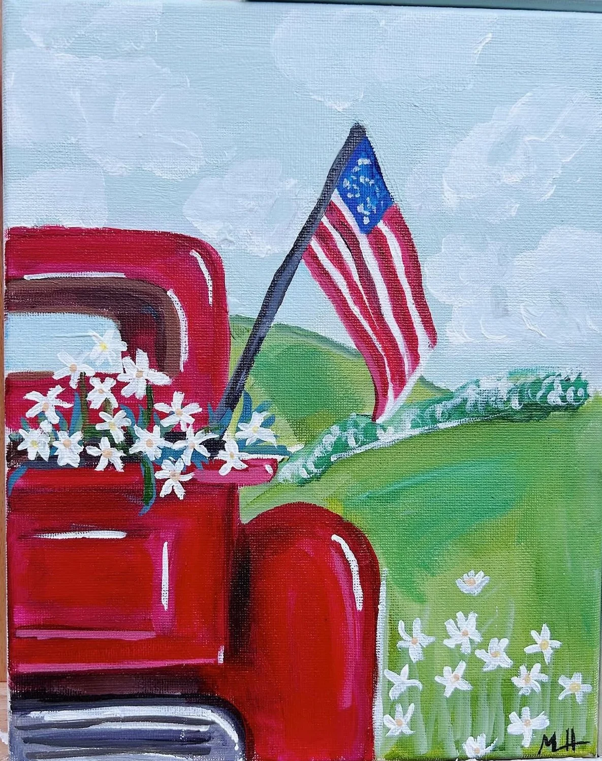 Painting of a red truck with white flowers in the back, an American flag on a pole, and green rolling hills with small white flowers.
