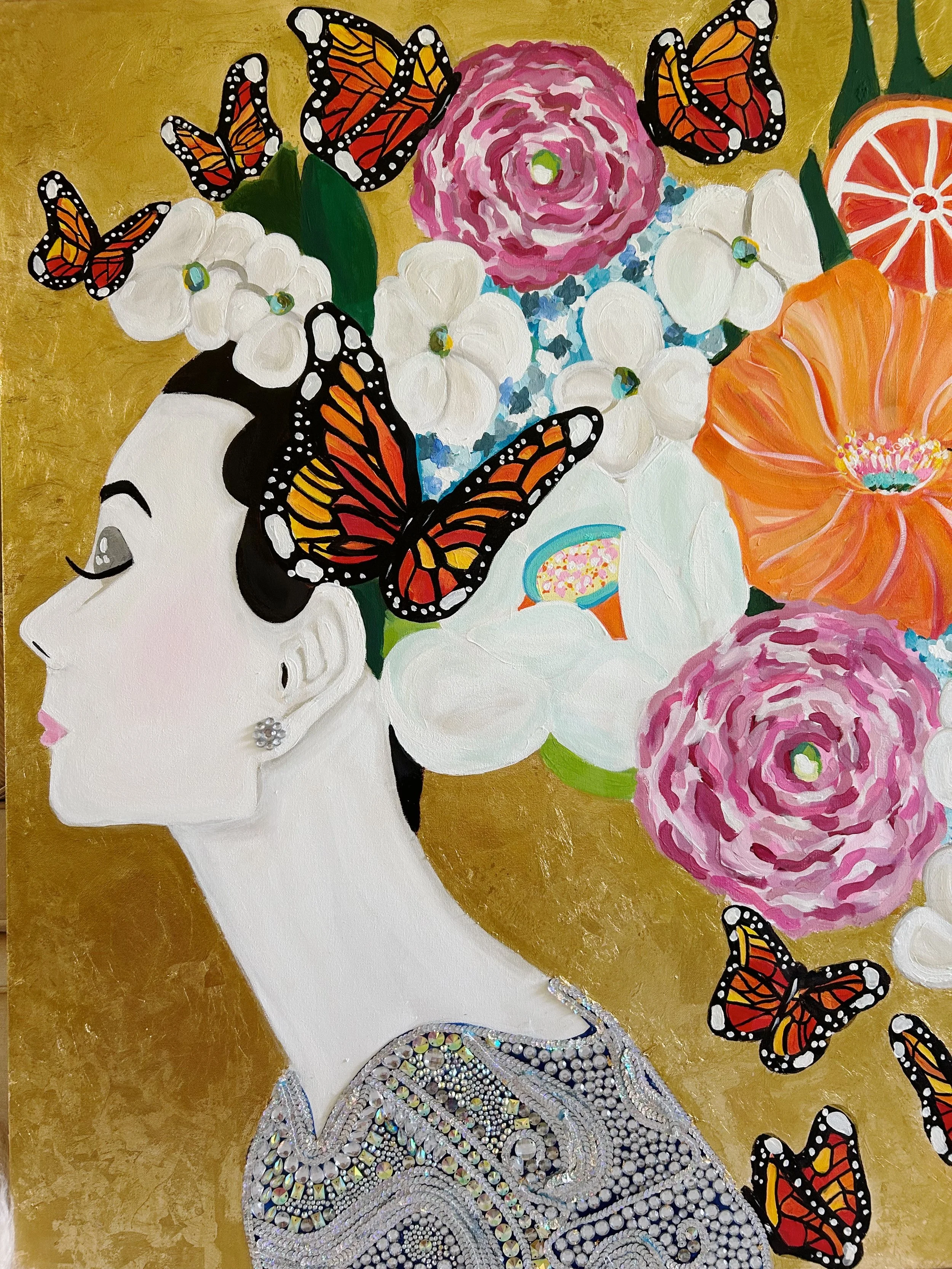 Artistic portrait of a woman with black hair and earrings, surrounded by colorful flowers and Monarch butterflies, with a gold background.