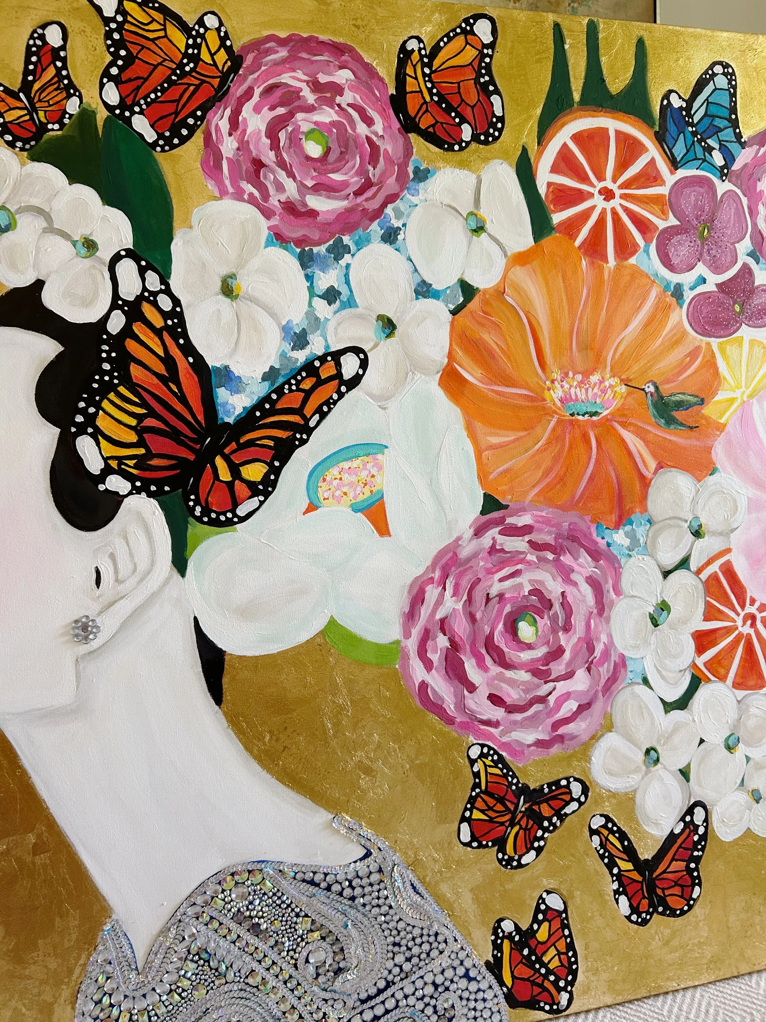 Colorful painting of a woman's head with long black hair, surrounded by flowers, butterflies, a hummingbird, and a citrus slice, all on a gold background.