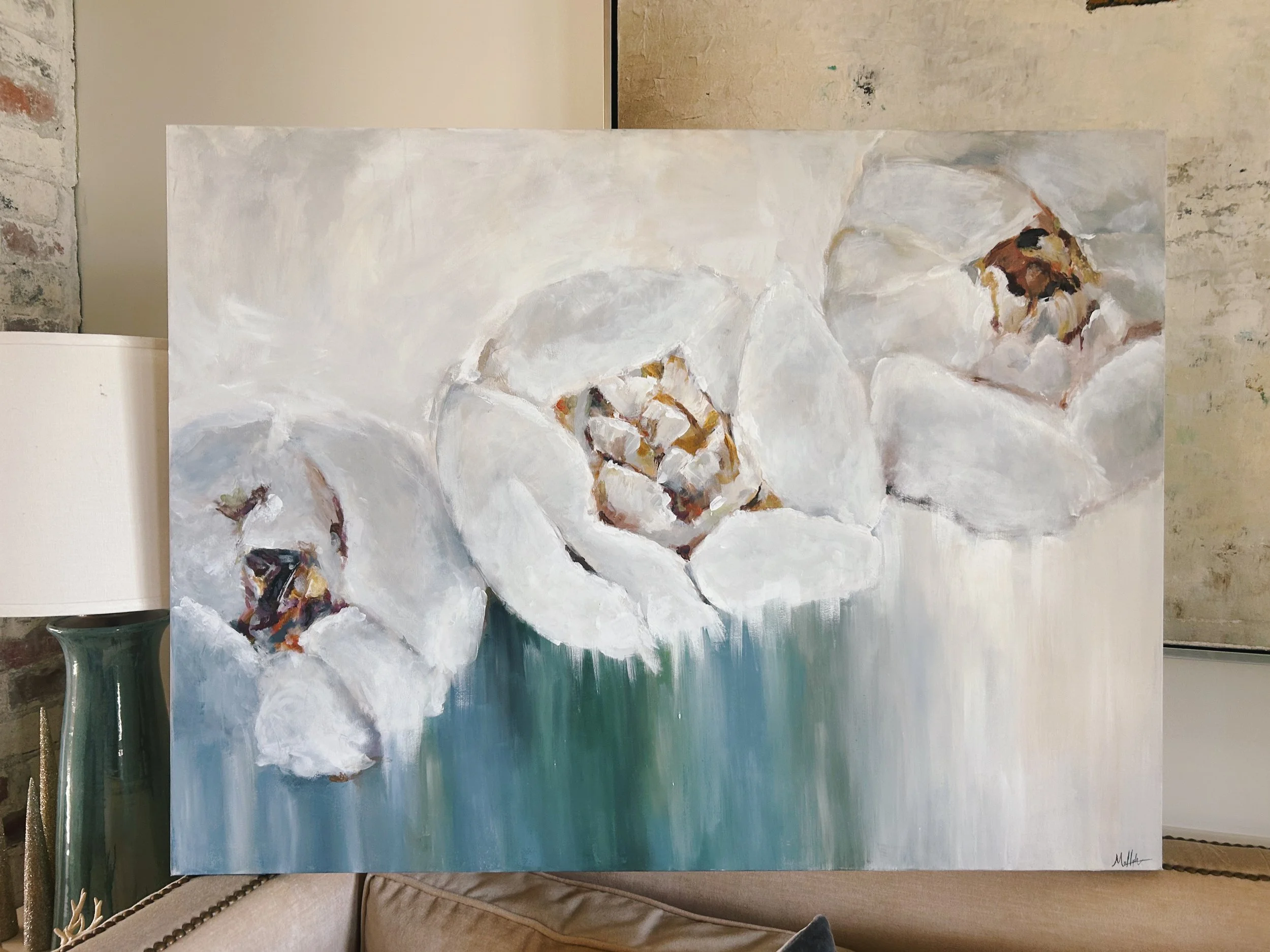 An abstract painting of three white flowers with dark centers on a light background.