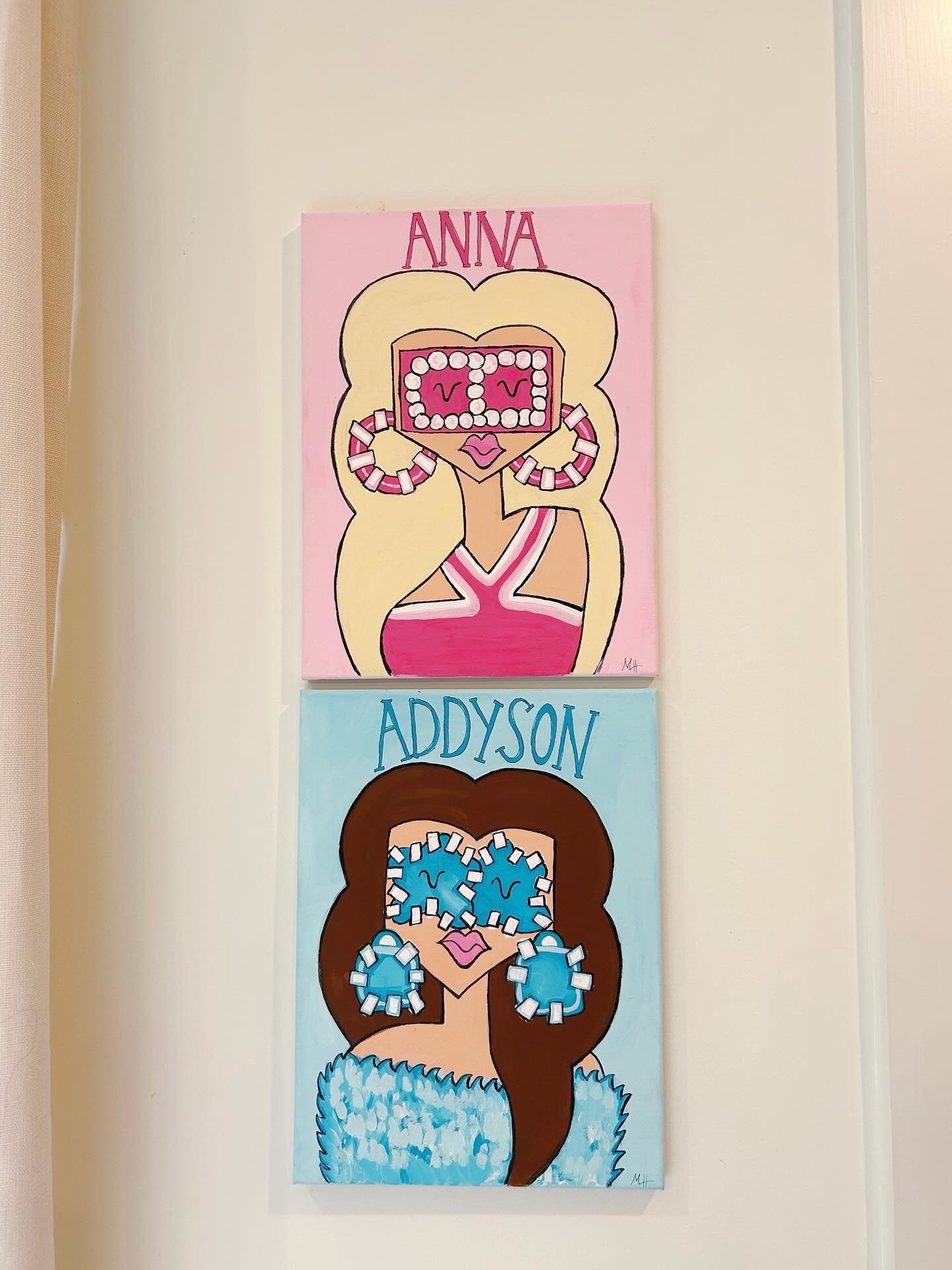 Two colorful paintings of women, one with blonde hair and pink background, the other with brown hair and blue background, both with cartoonish faces and accessories, with names 'Anna' and 'Addyson' above each.
