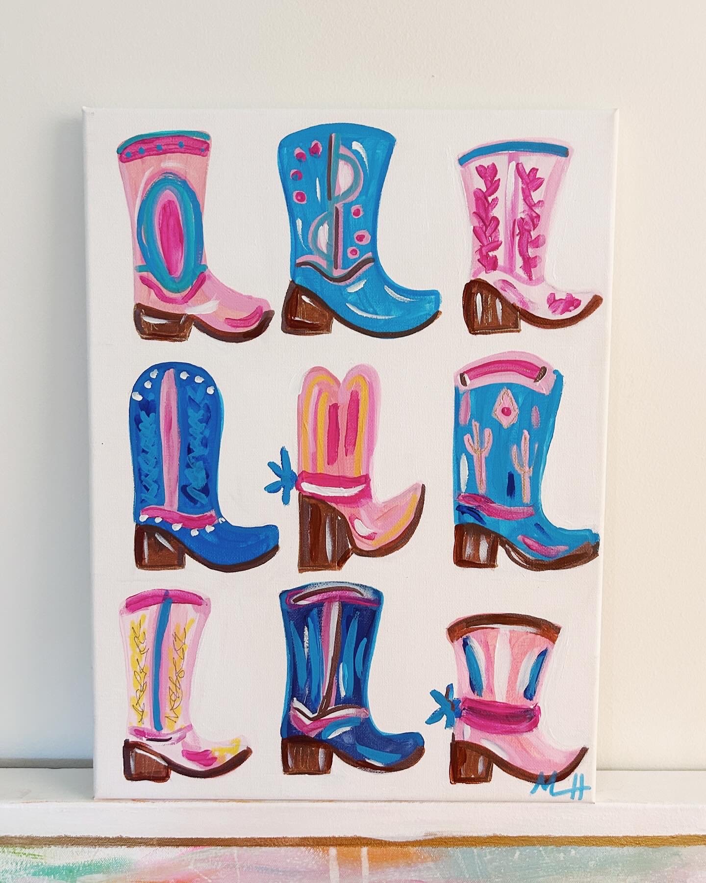 A colorful painting of nine cowboy boots with various designs and colors arranged in a 3x3 grid.