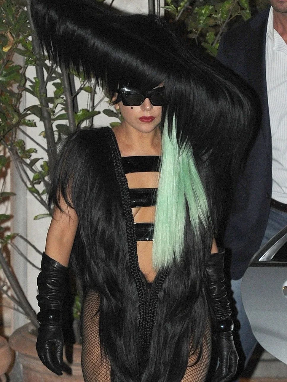 On October 6th, 2011, @ladygaga stepped out to attend a HTC x Beats by Dre launch event while in town promoting her album #BornThisWay and meeting with designers. She wore a hat and dress from @charlielemindu S/S 2012 collection along with vintage su