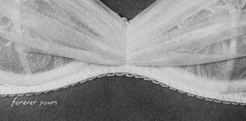 Close-up of a book with the words "forever yours" written in the bottom left corner.