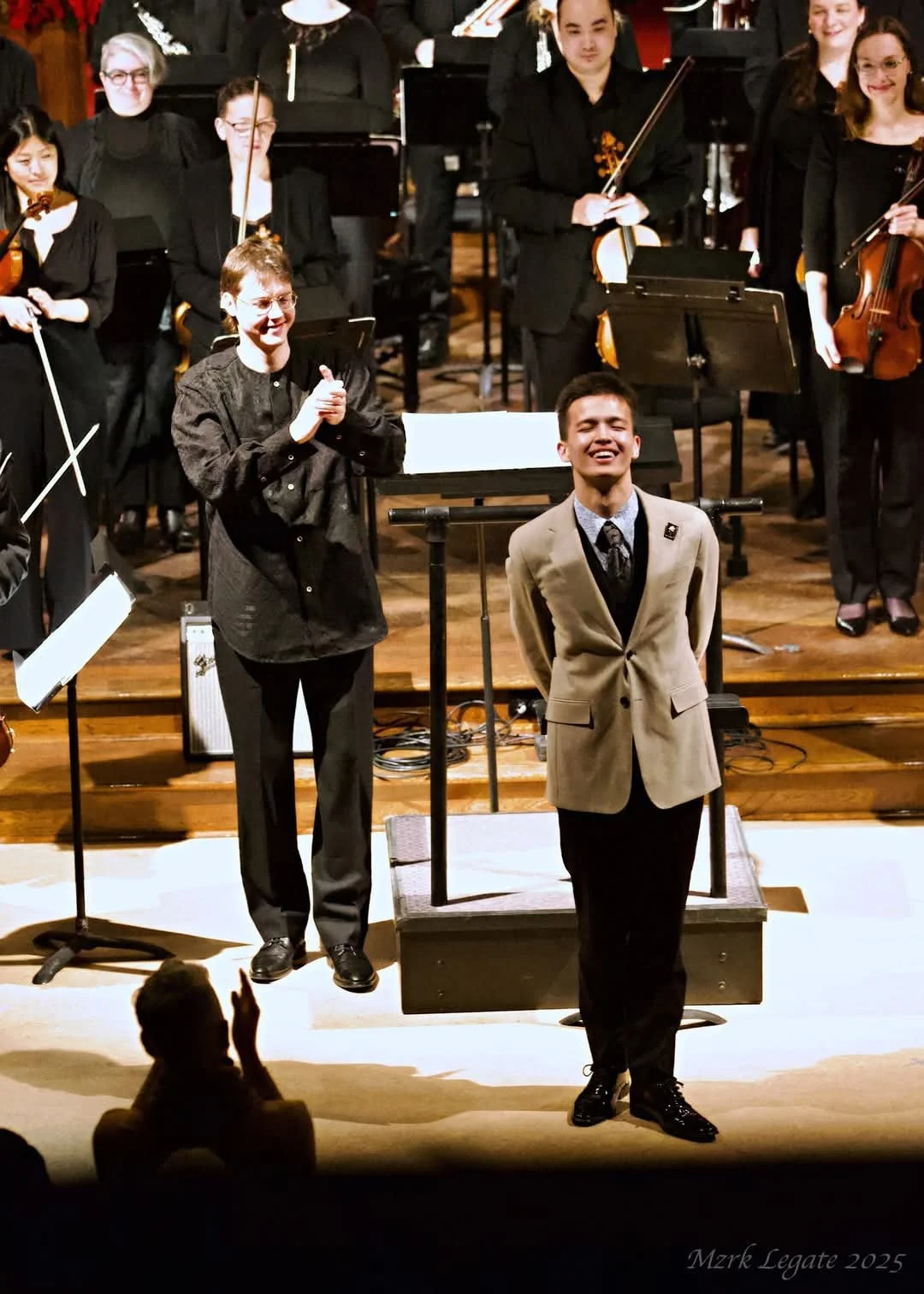 Jeremie taking a bow for the premiere of his orchestral piece, "Malhastrophy", at the 2025 Open Waters Festival