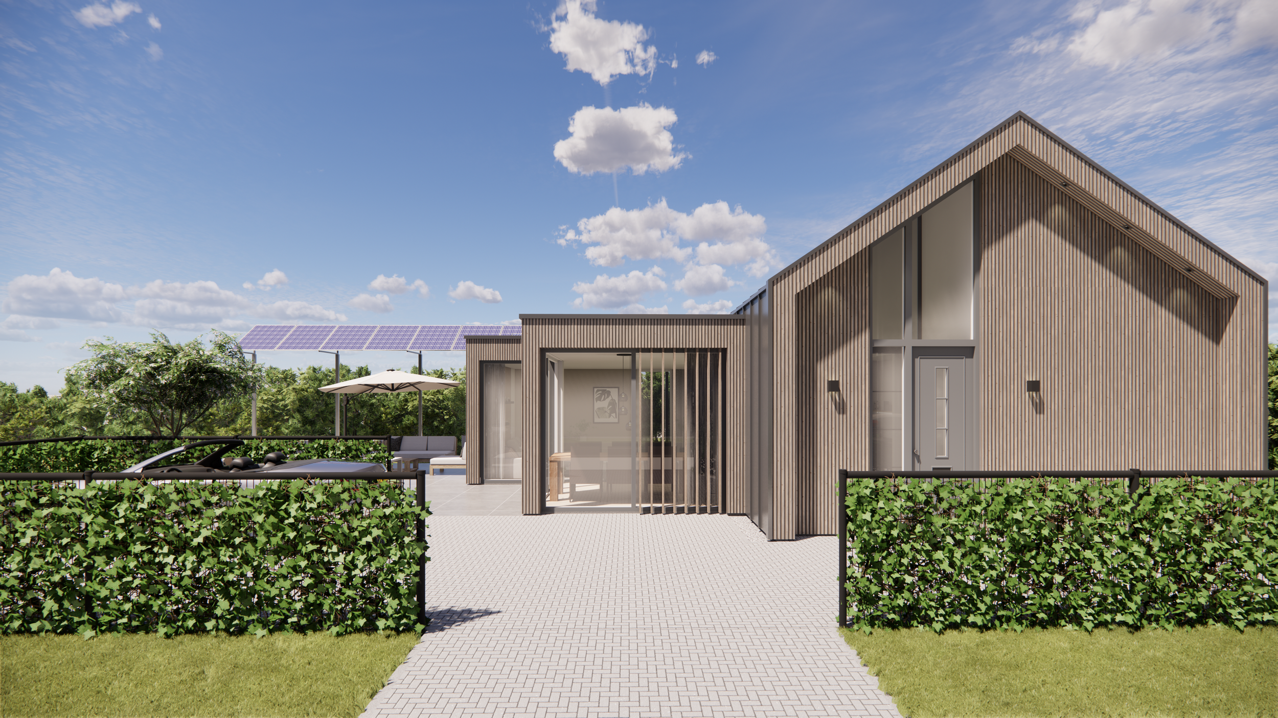 Modern house with wooden exterior, large glass windows, and a patio area with outdoor seating and umbrellas, set against a backdrop of solar panels and blue sky with scattered clouds.