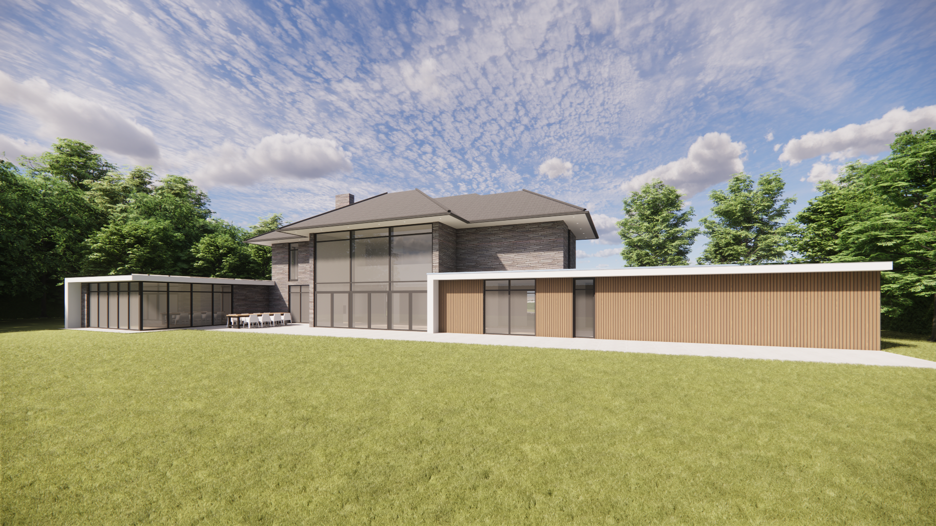 Modern house with large glass windows, a gray roof, and a combination of dark brick and wooden exterior panels, set in a green yard with trees background and a blue sky with scattered clouds.