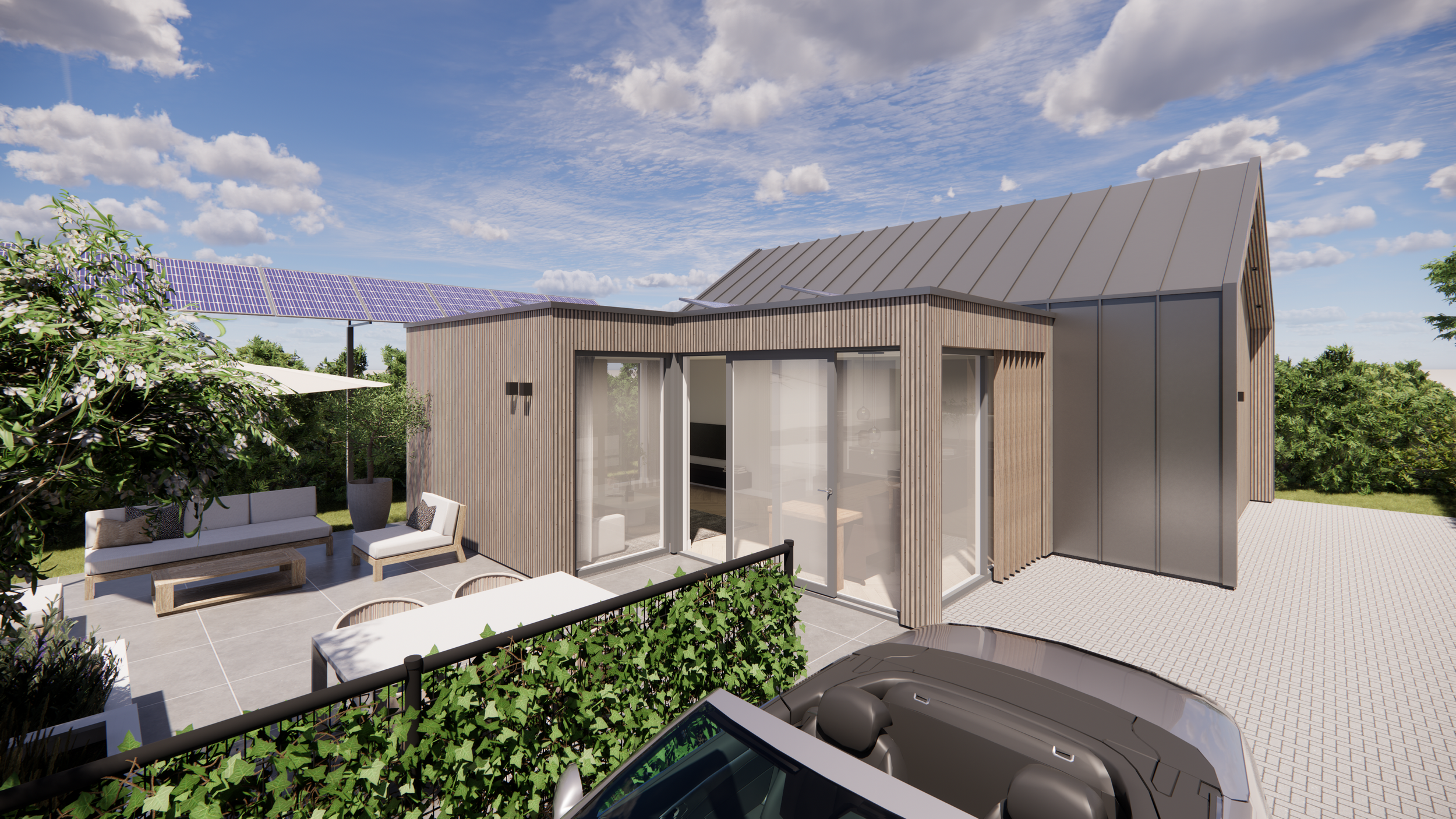 Modern house with wooden exterior, glass doors, outdoor seating area, solar panels, car parked in driveway, and green landscaped surroundings under a partly cloudy sky.