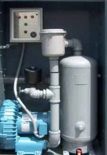 An industrial water treatment system with pipes, a control panel, and filtration units.