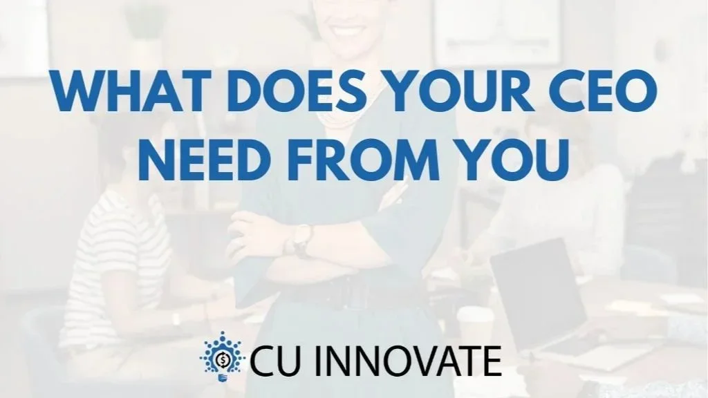 Text overlay on a blurred background of a business office with people working at a table. The text reads: "What does your CEO need from you" and "CU Innovate".