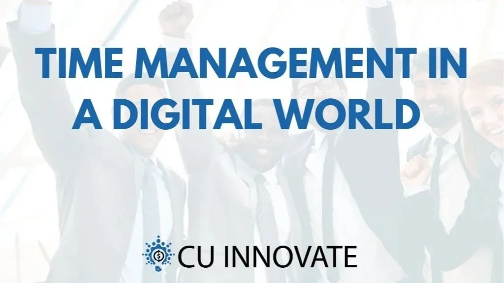 People celebrating in a professional setting with a slideshow titled 'Time Management in a Digital World' by CU Innovate.