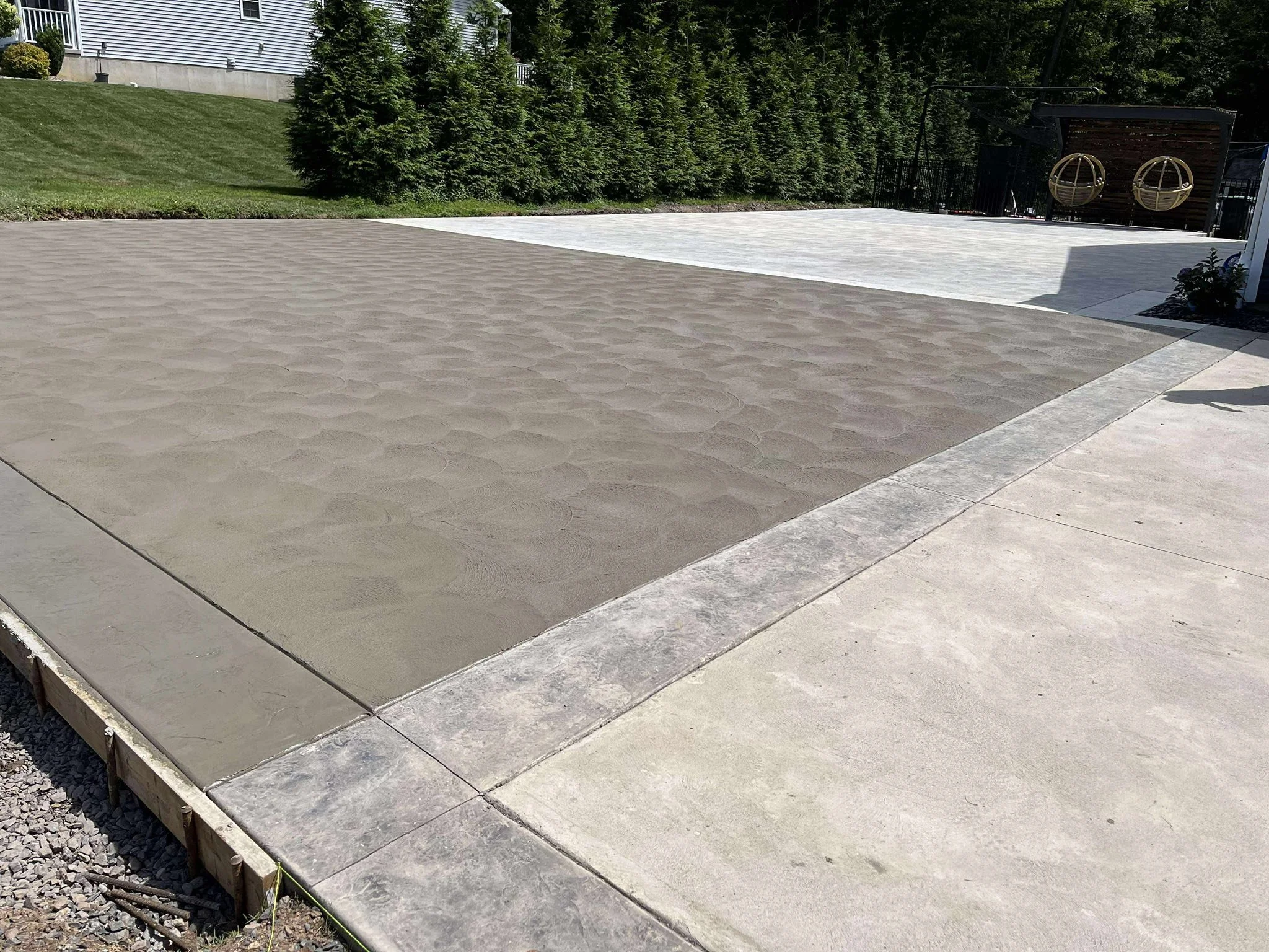 Newly installed concrete patio at residential home