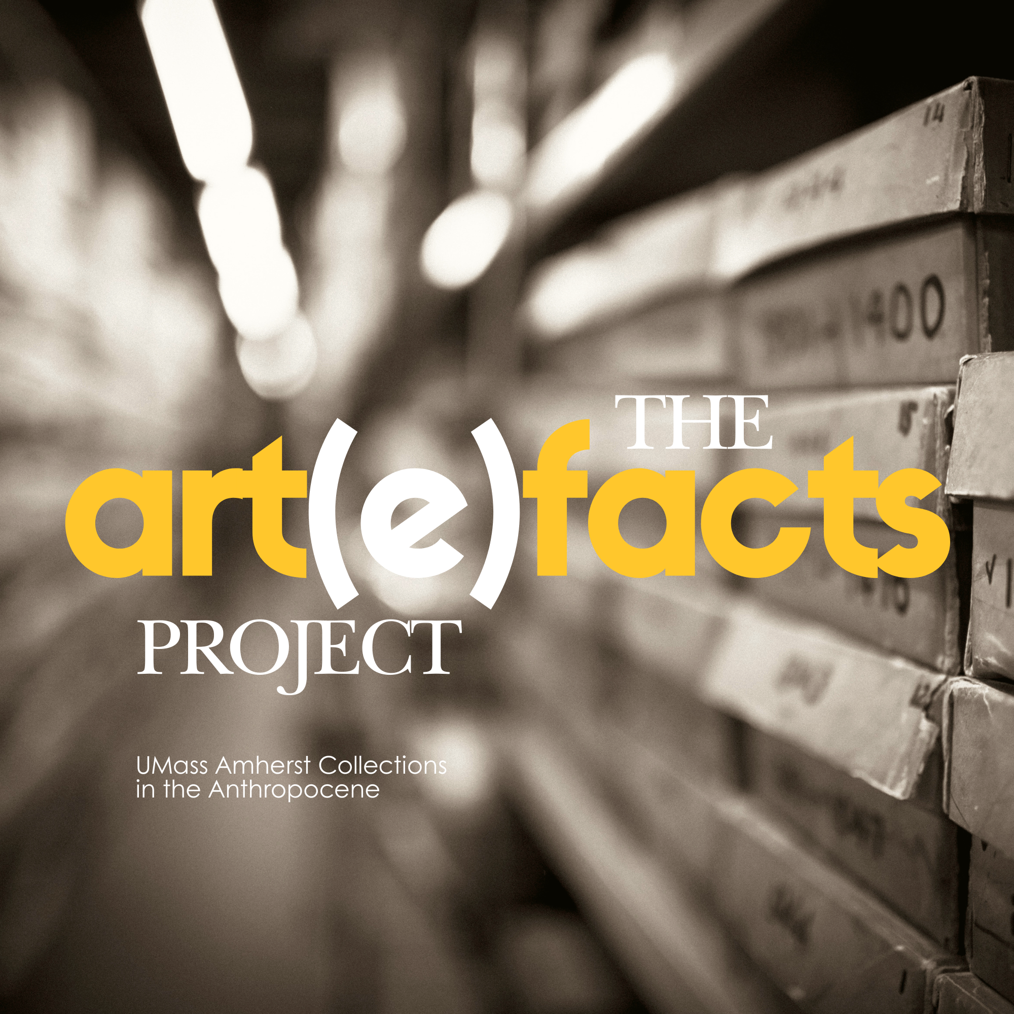 Poster of blurred out archive boxes stating The Art(e)facts Project Umass Amherst Collections in the Anthropocene. The background is in grey tones and the words are in white with "art" and "facts" in yellow