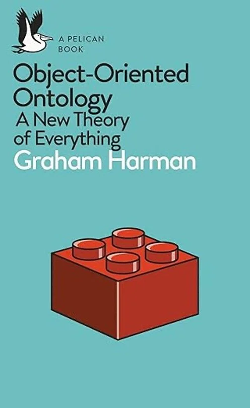 The cover for Object-Oriented Ontology: A New Theory of Everything by Graham Harman. The cover is solid teal with a single red Lego brick in the middle with four points. A pelican is in the upper corner for Pelican Books