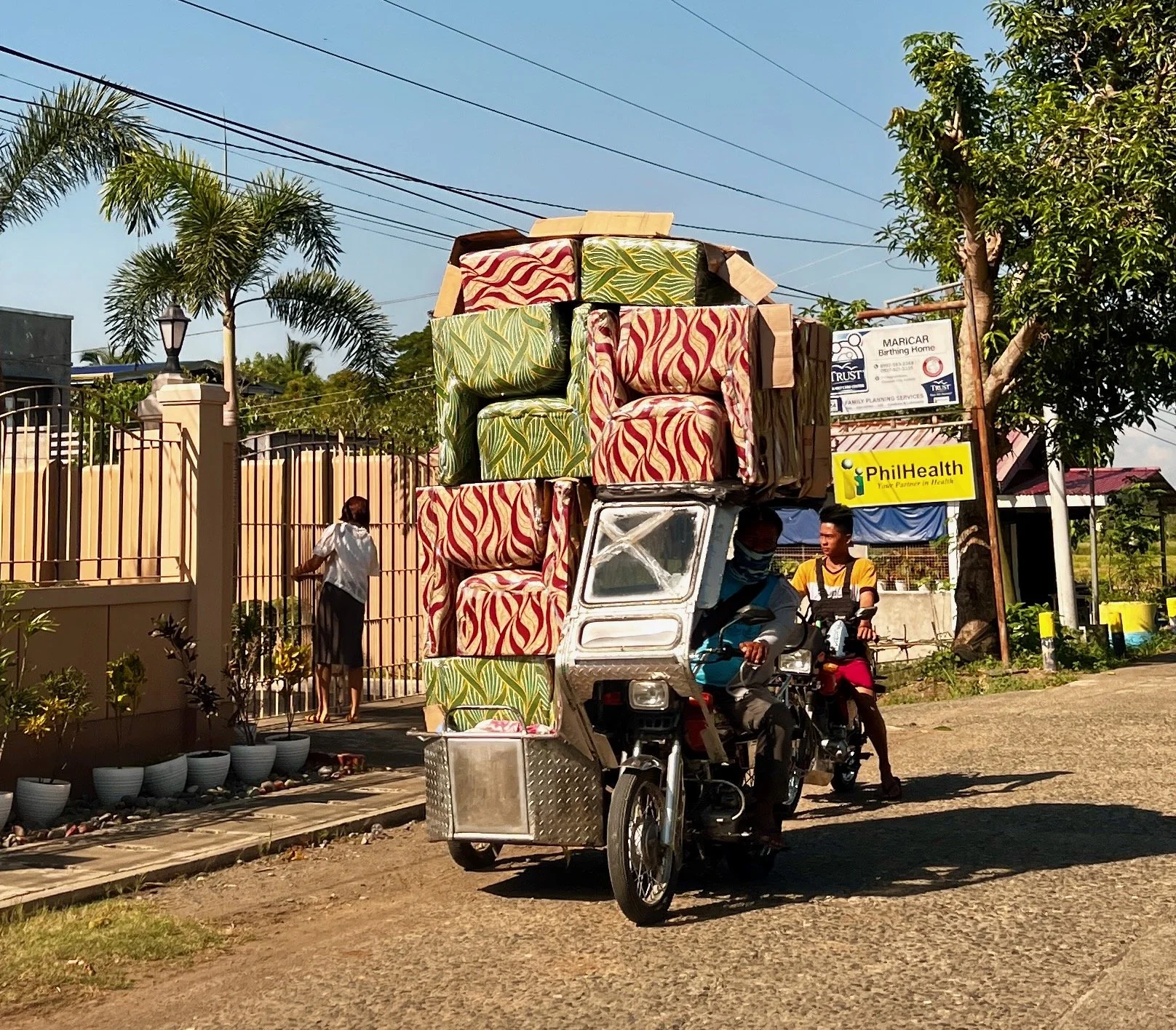Tricycle driver delivering chairs