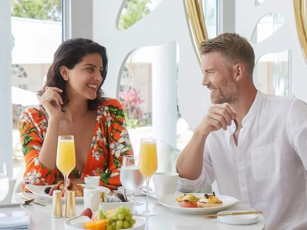 Couple dining together at Sandals Royal Bahamian, an adults-only all-inclusive resort in the Bahamas