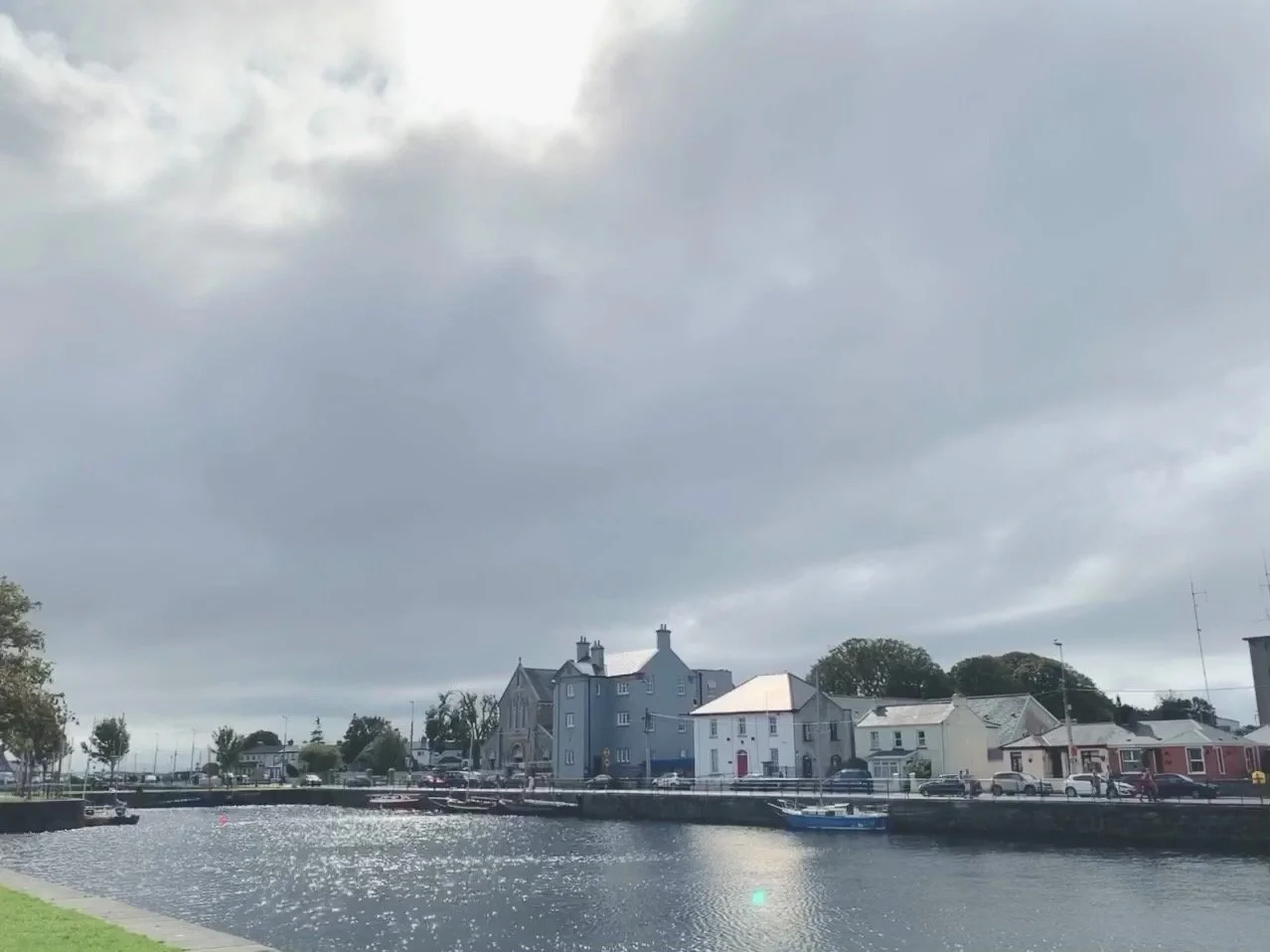 The Long Walk in Galway, Ireland, featuring historic waterfront houses along Galway Bay