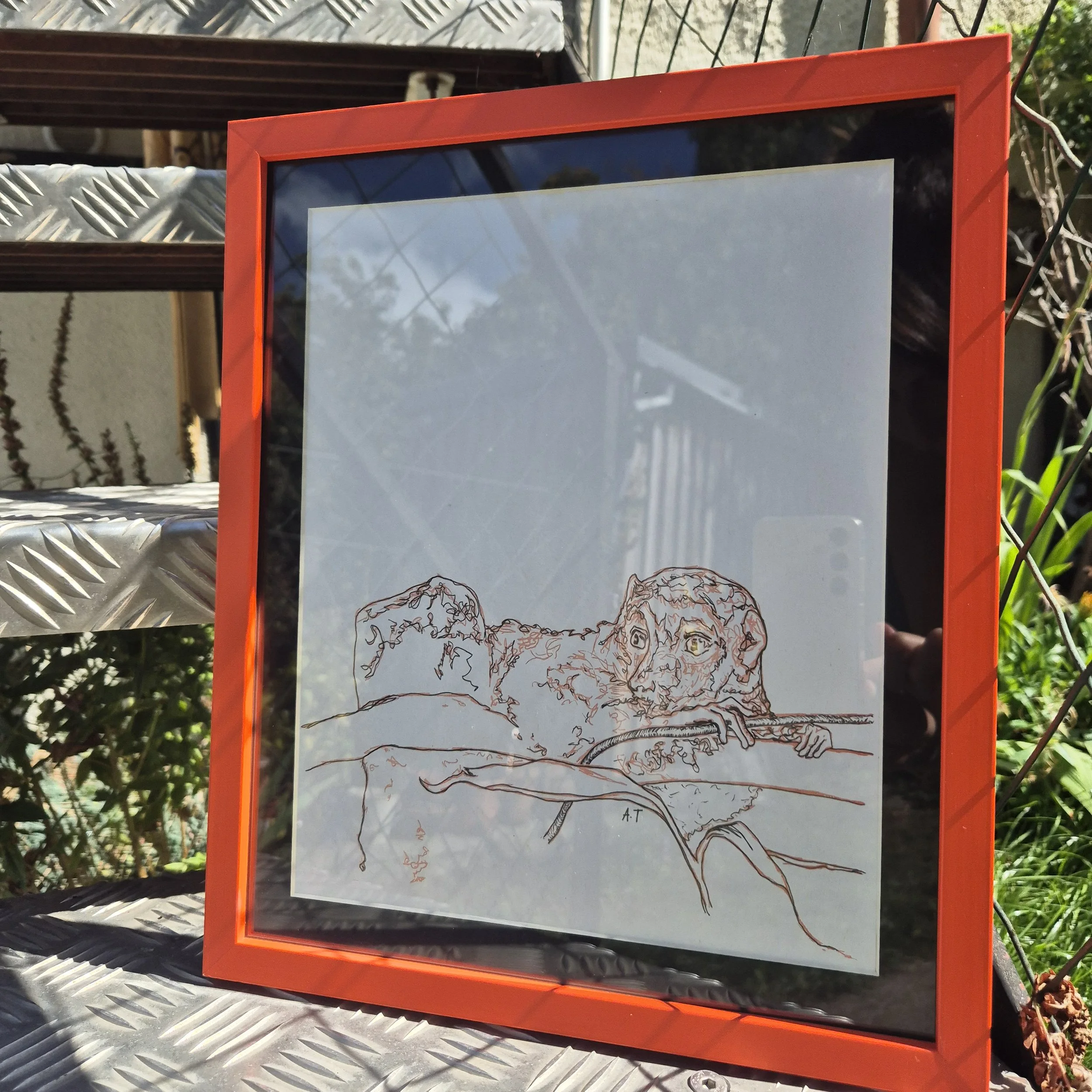 A framed print, photographed on outdoor aluminium steps