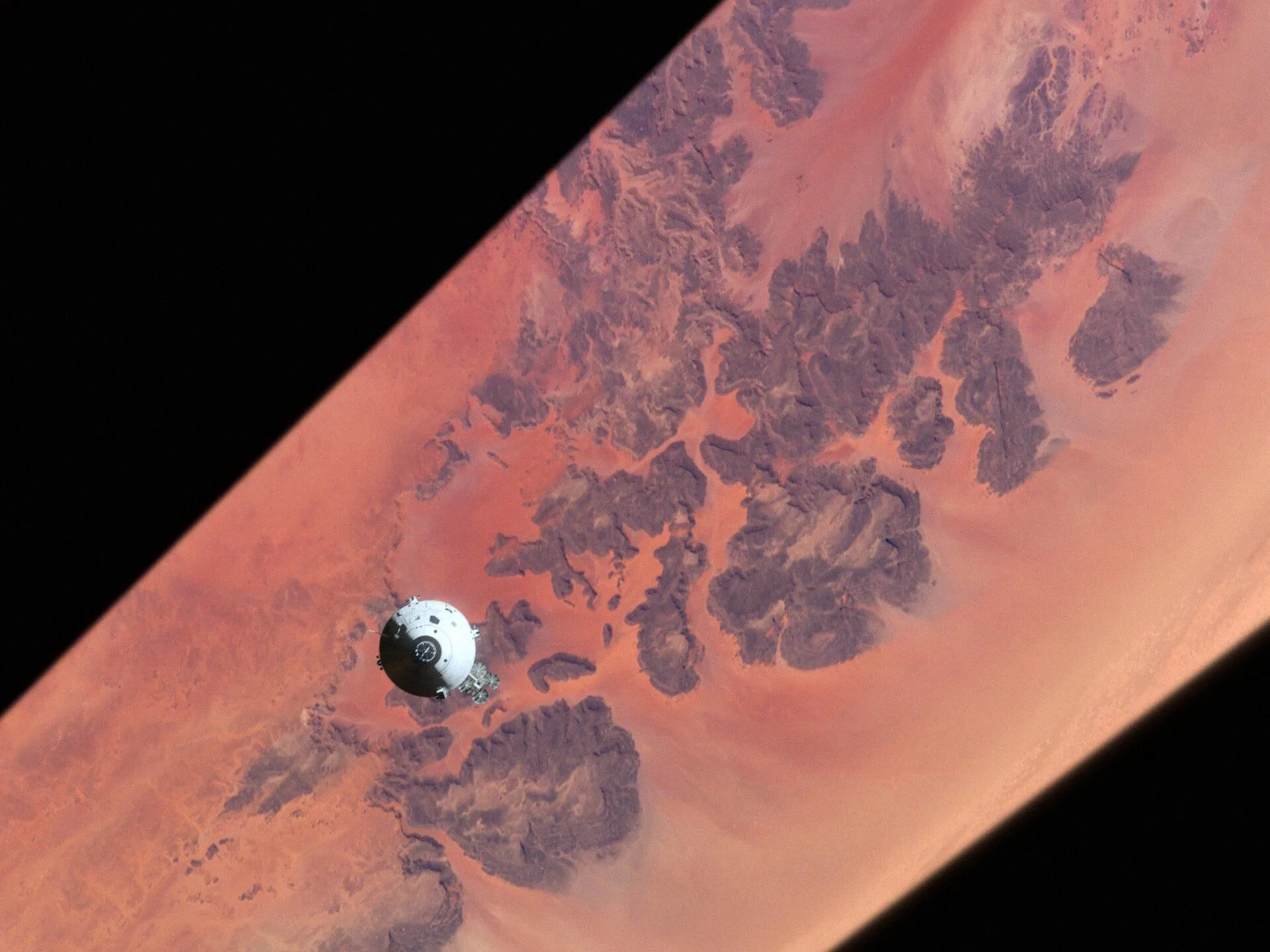 A white-painted Apollo module over the desert