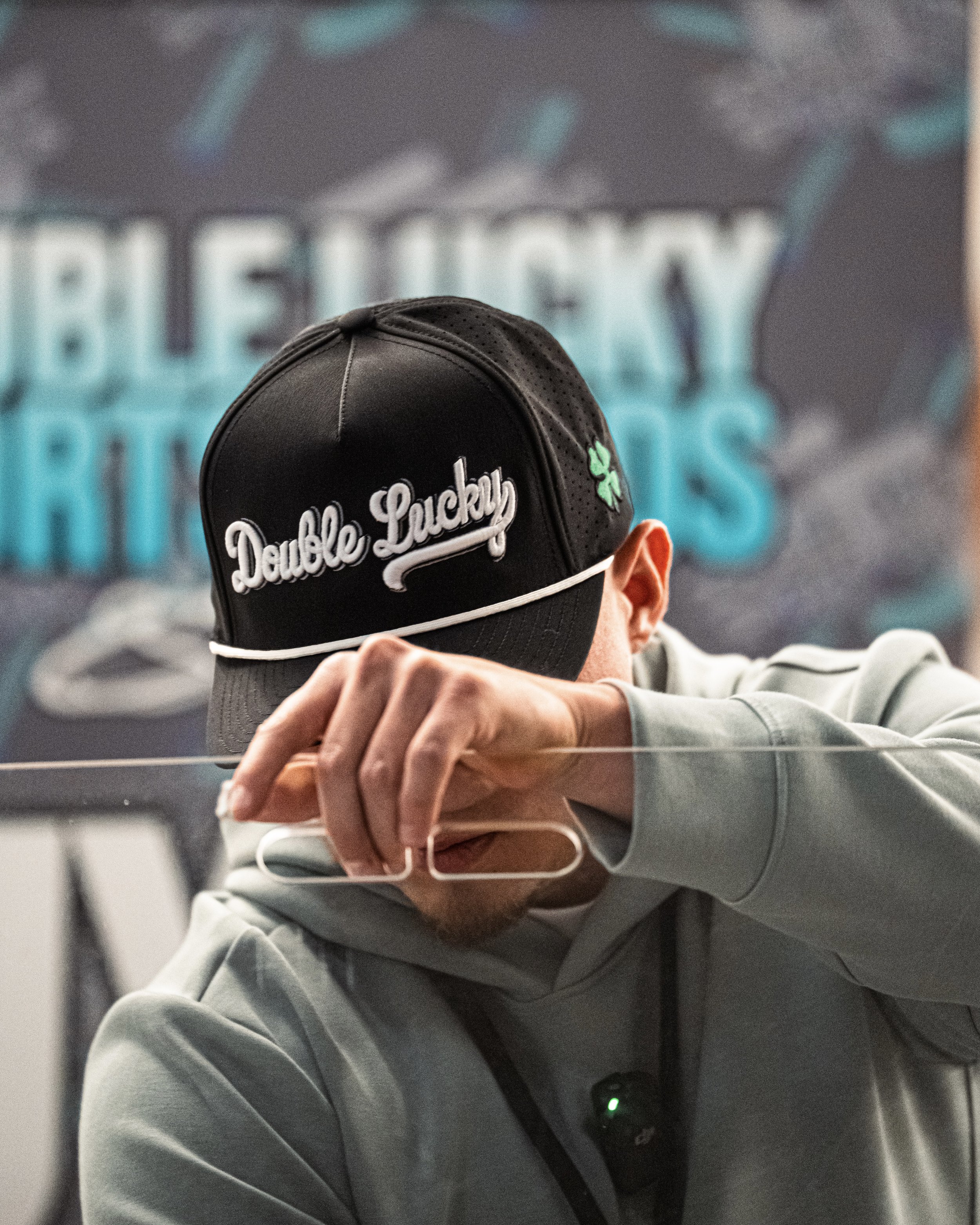 A person wearing a black cap with