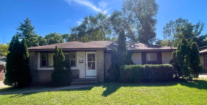 brown house with blue sky