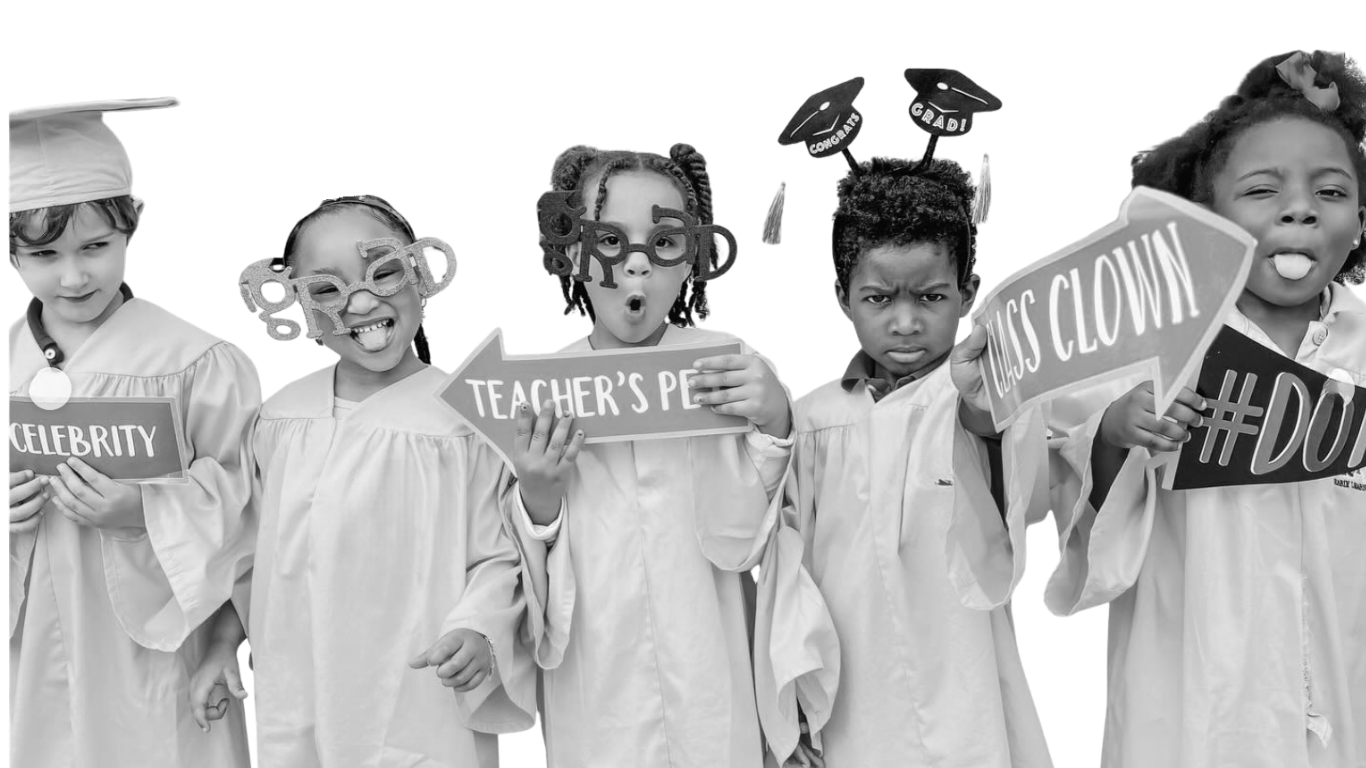 Five children dressed in graduation gowns and caps holding speech bubbles with various words and phrases, some making funny faces.
