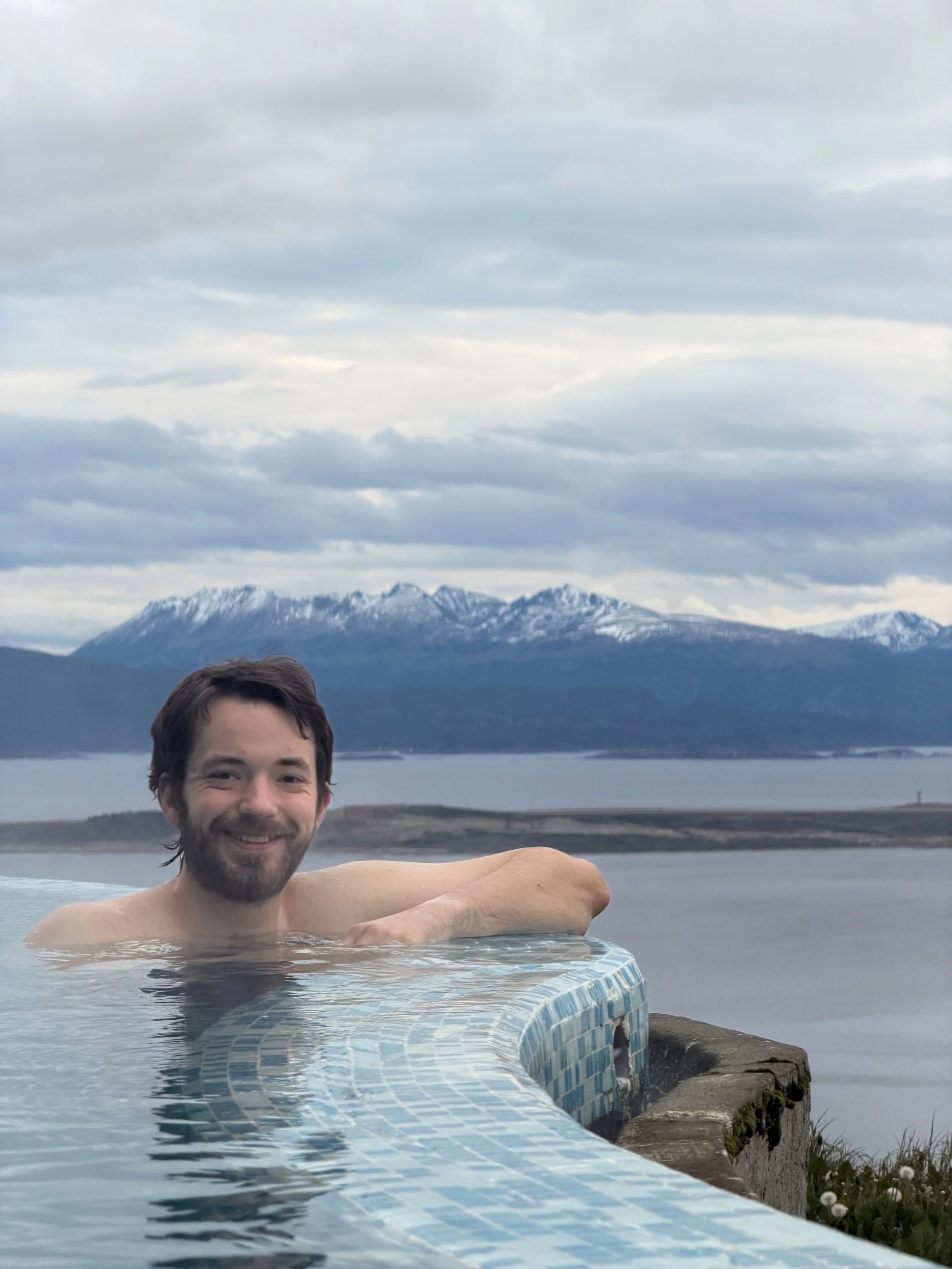 Alex posing for a photo in the hotel outdoor hot tub