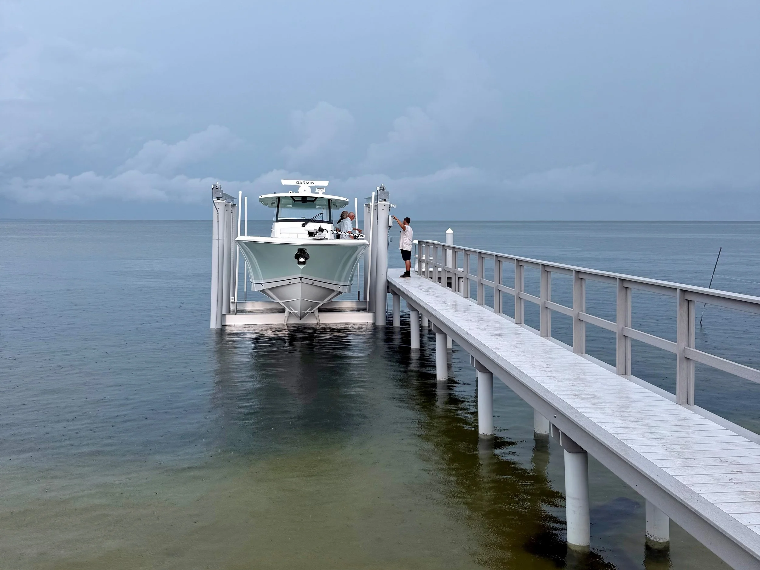 Pursuit S 358 on boat lift