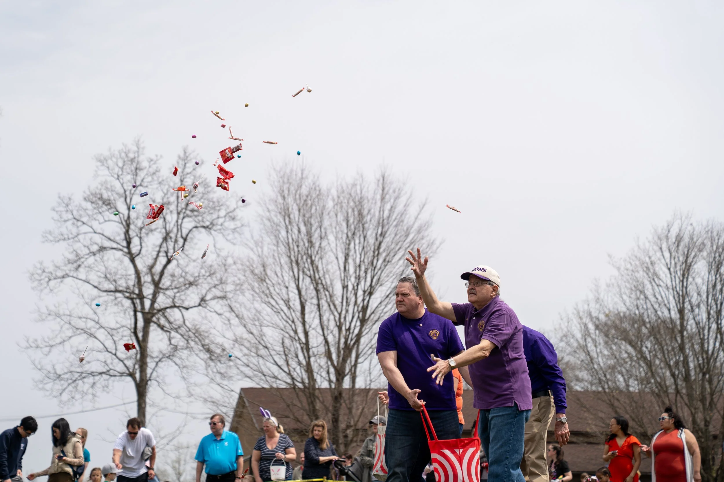 People participating in an outdoor community event in an open field