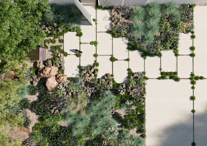 Vue aérienne d'un jardin urbain avec des chemins en pierre, des plantes vertes et des rochers, entouré de murs et d'une clôture en métal.