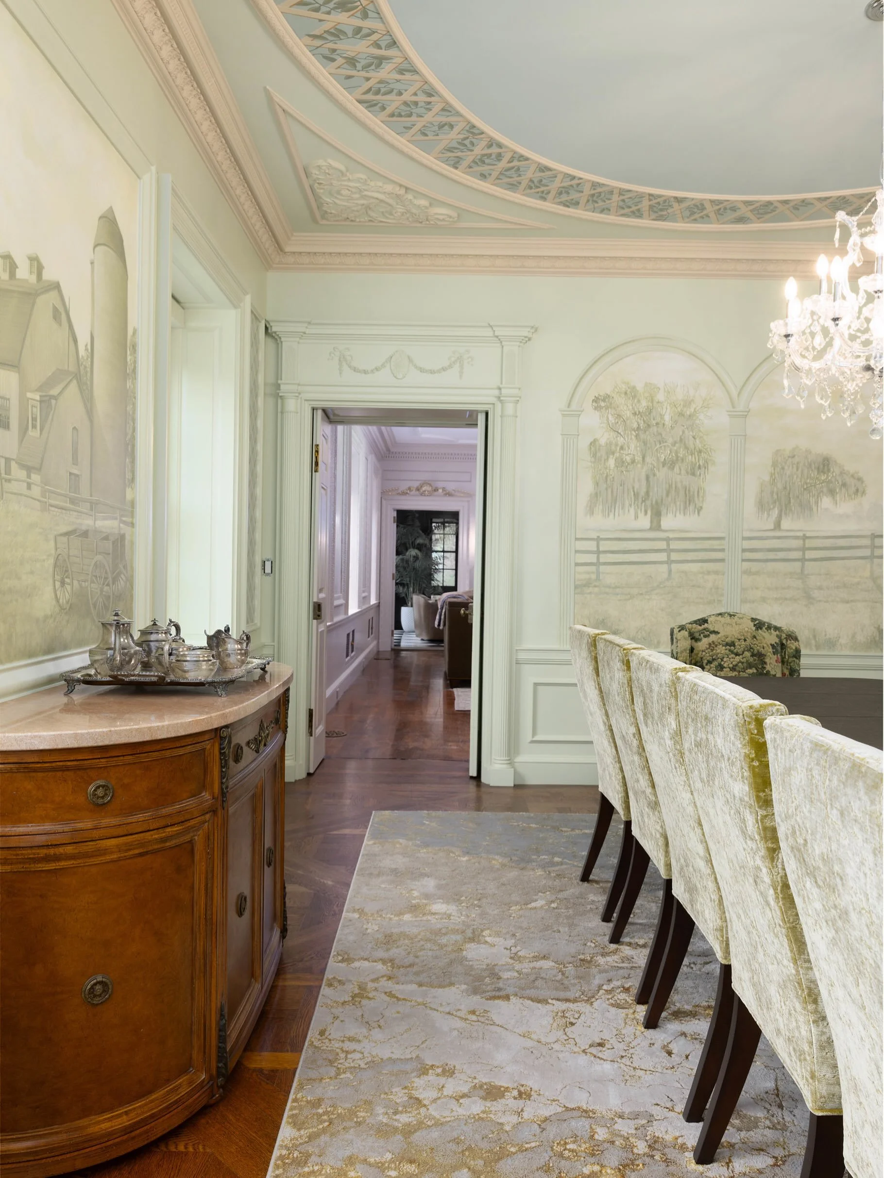 Inspired by the romantic salons of Ladur&eacute;e Paris, our dining room was imagined as a place where beauty sets the stage for connection.

Soft hues, hand-painted landscapes, crystal light, and a sky-blue ceiling create a room that feels timeless,