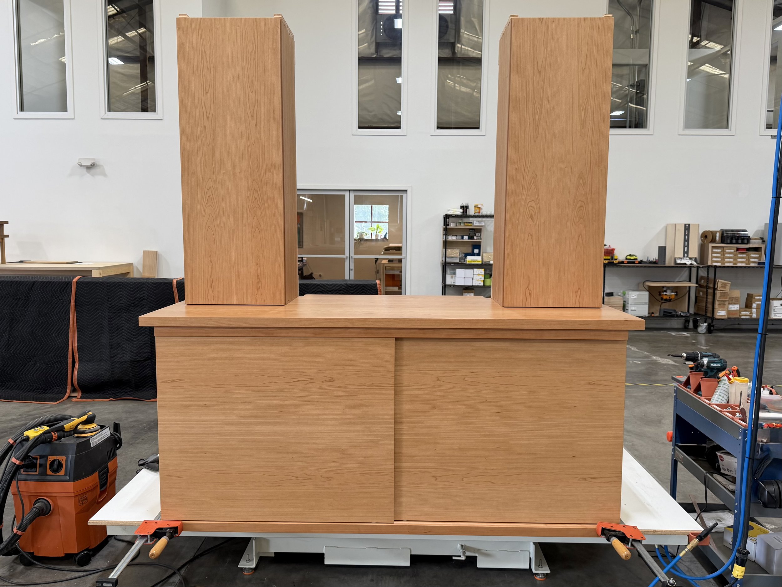 Cherry bathroom storage w/ sliding doors