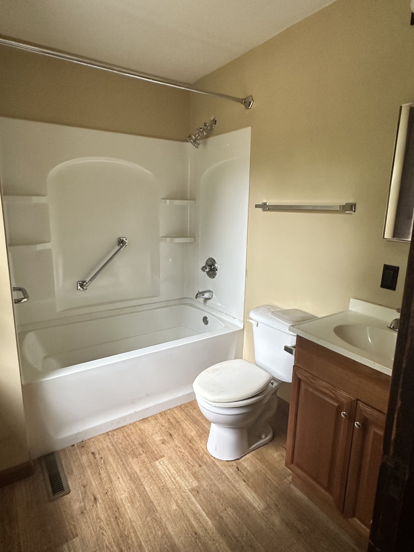*Paint walls 
*Remove unnecessary bars and handles 
*New vanity and faucet 
*New mirror 
*New light fixture 