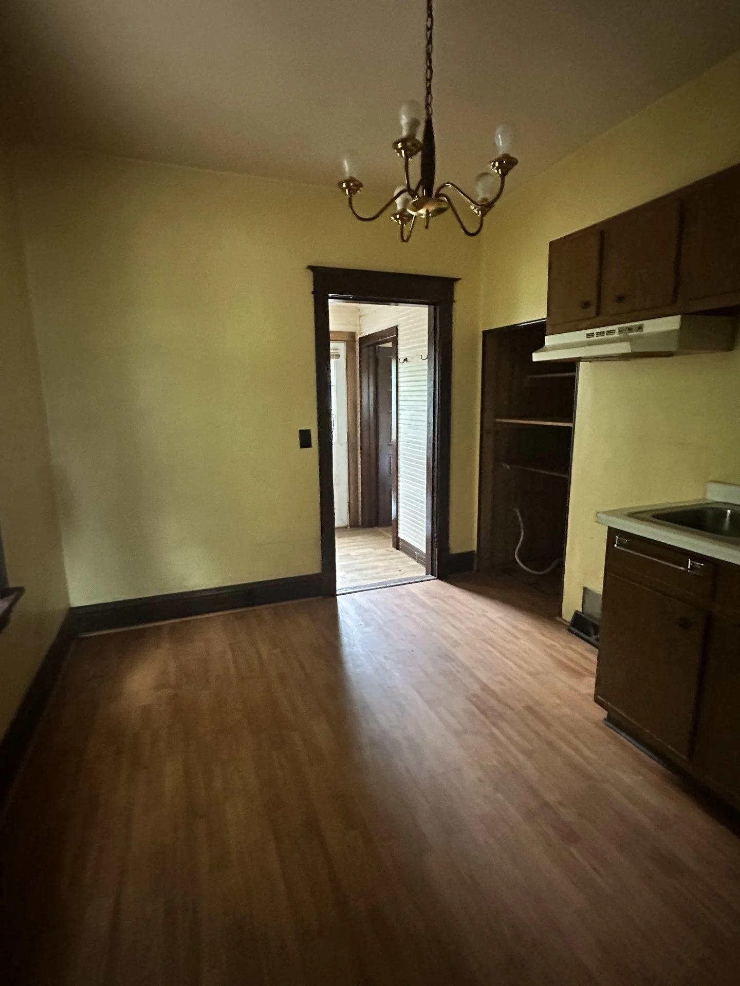 *Paint walls and trim 
*Add new cabinetry on the far wall 
*New wiring for stove on the far wall 