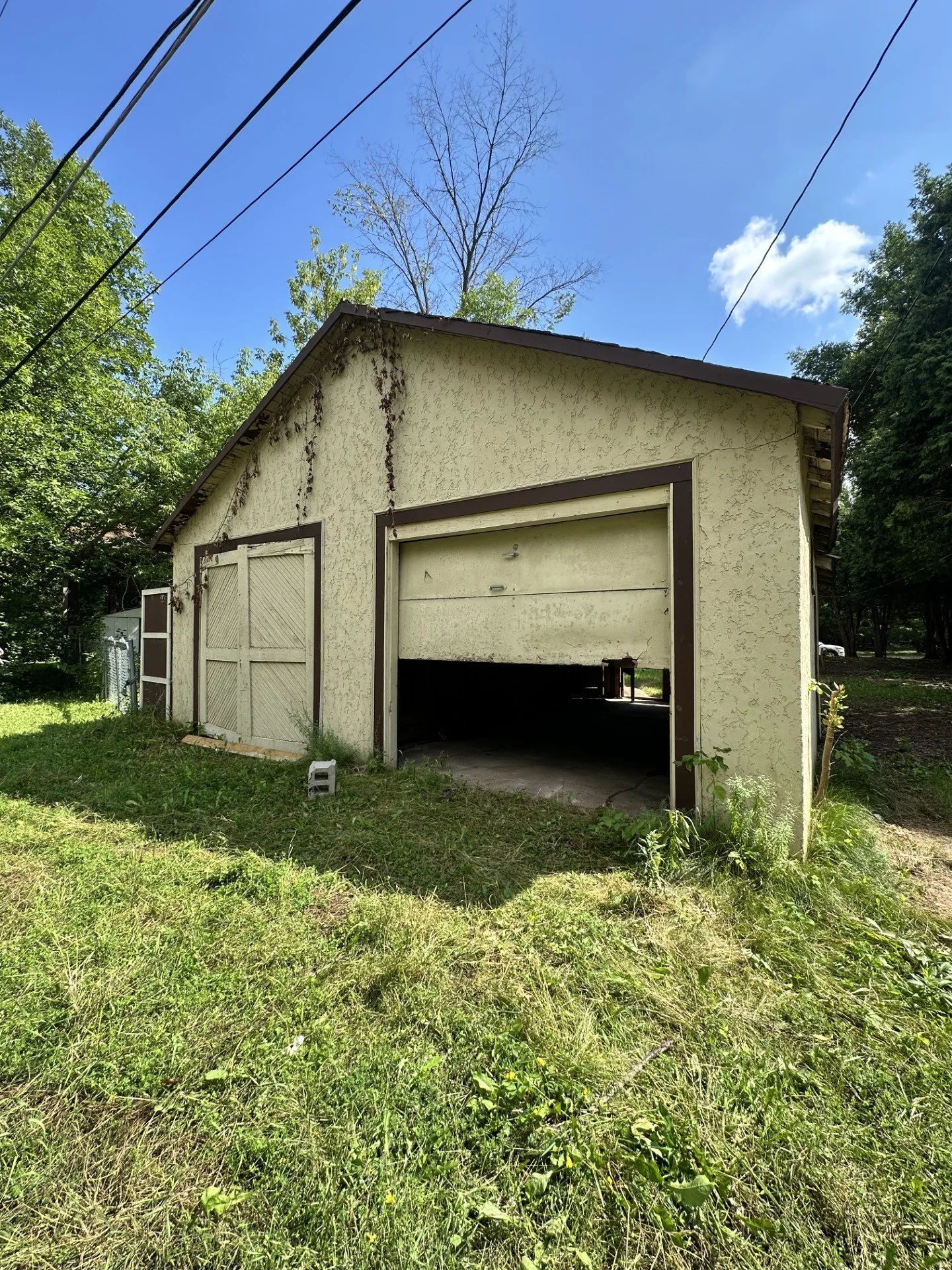 *New garage doors 
*Remove overgrowth
*Paint exterior