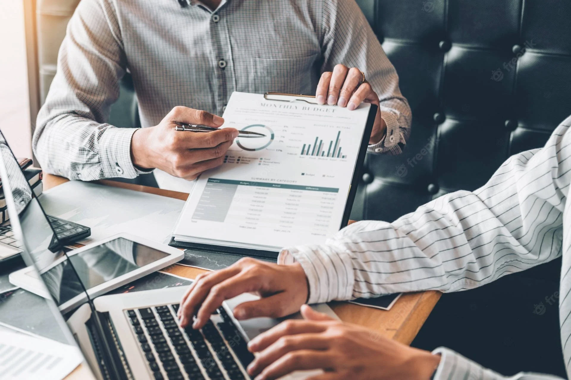 Business professionals analyzing data to optimize lead generation and AI-powered automation systems.