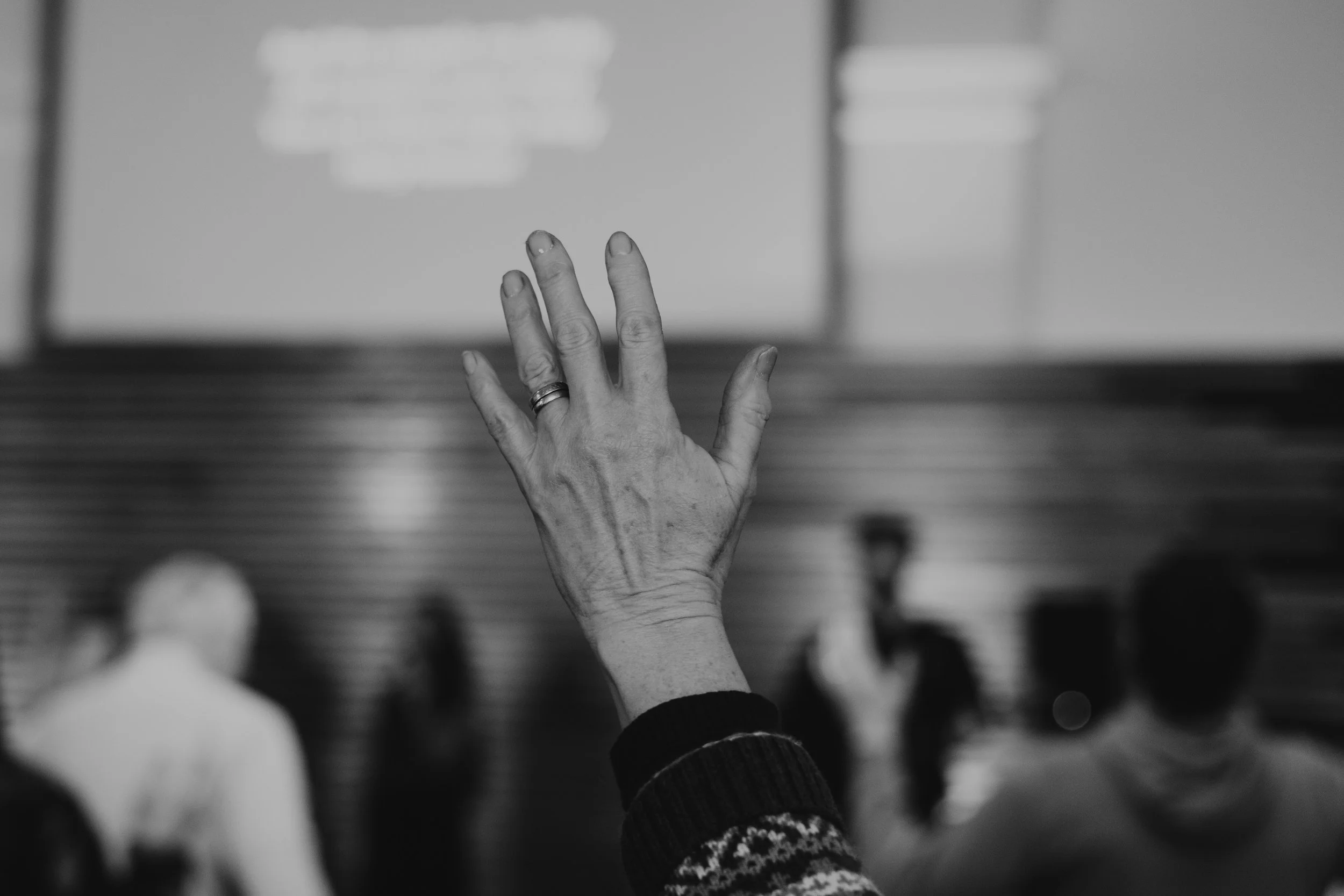 Photo of raised hand in worship