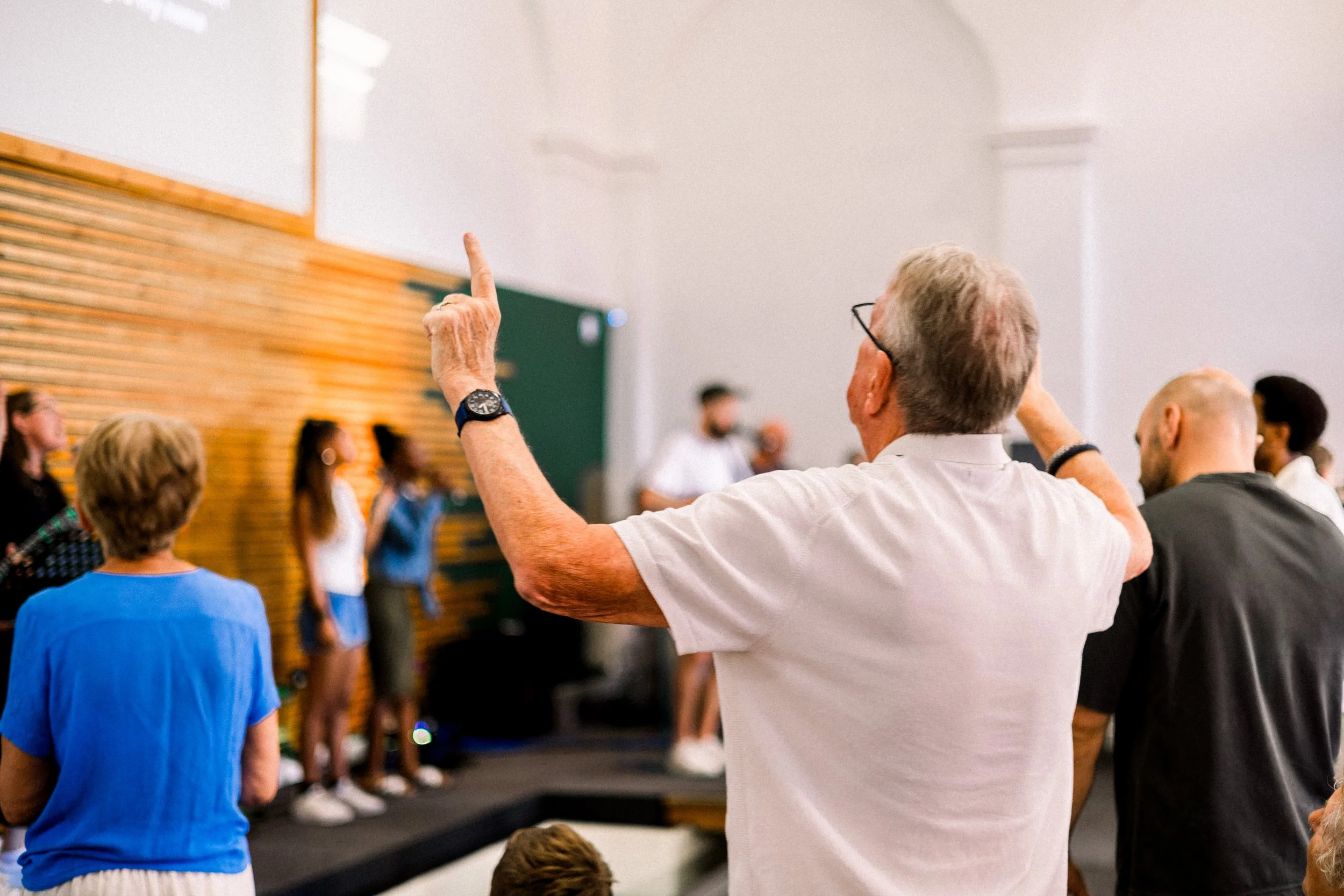 Man with hands pointed upwards during worship
