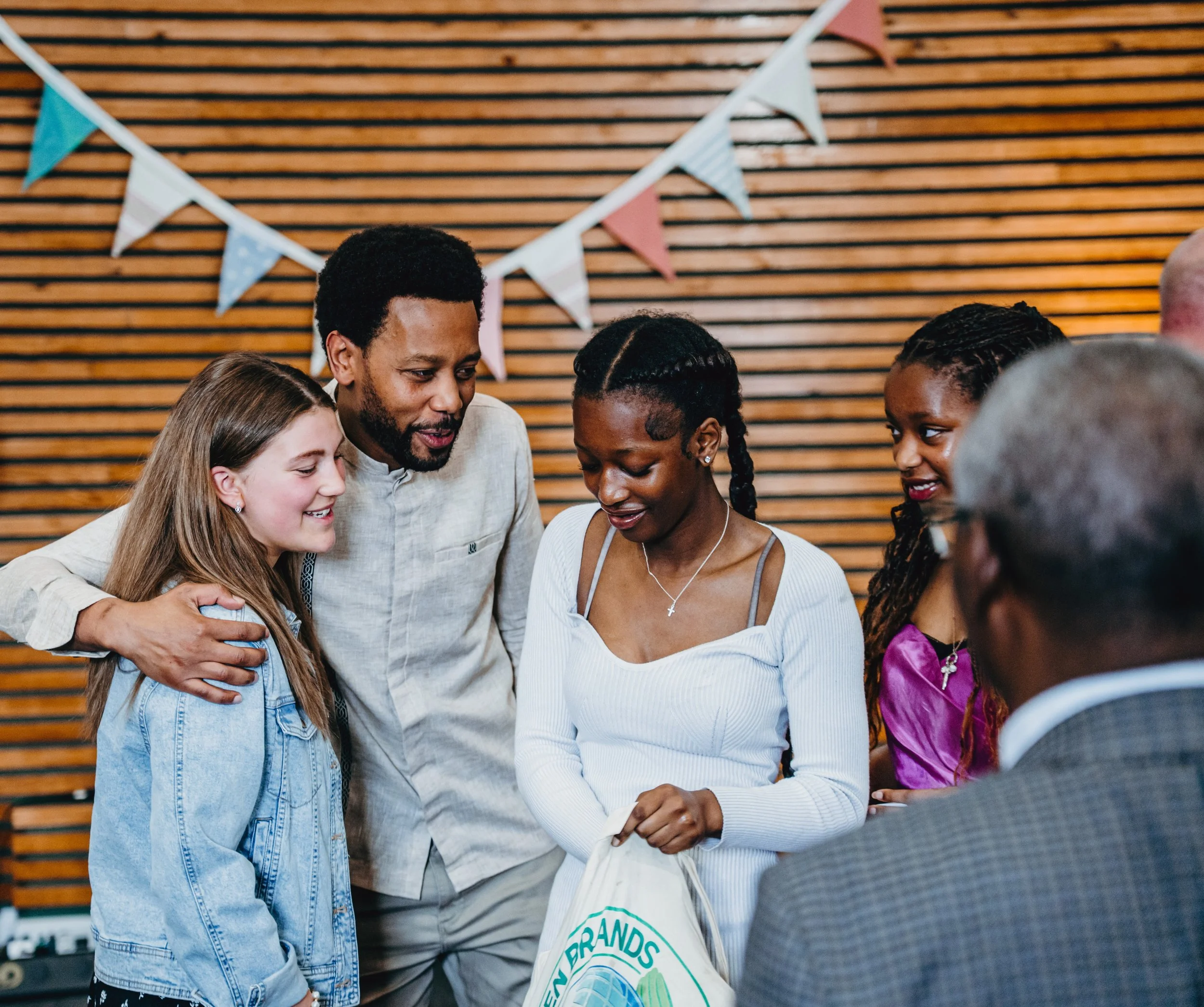 Family embracing on baptism Sunday